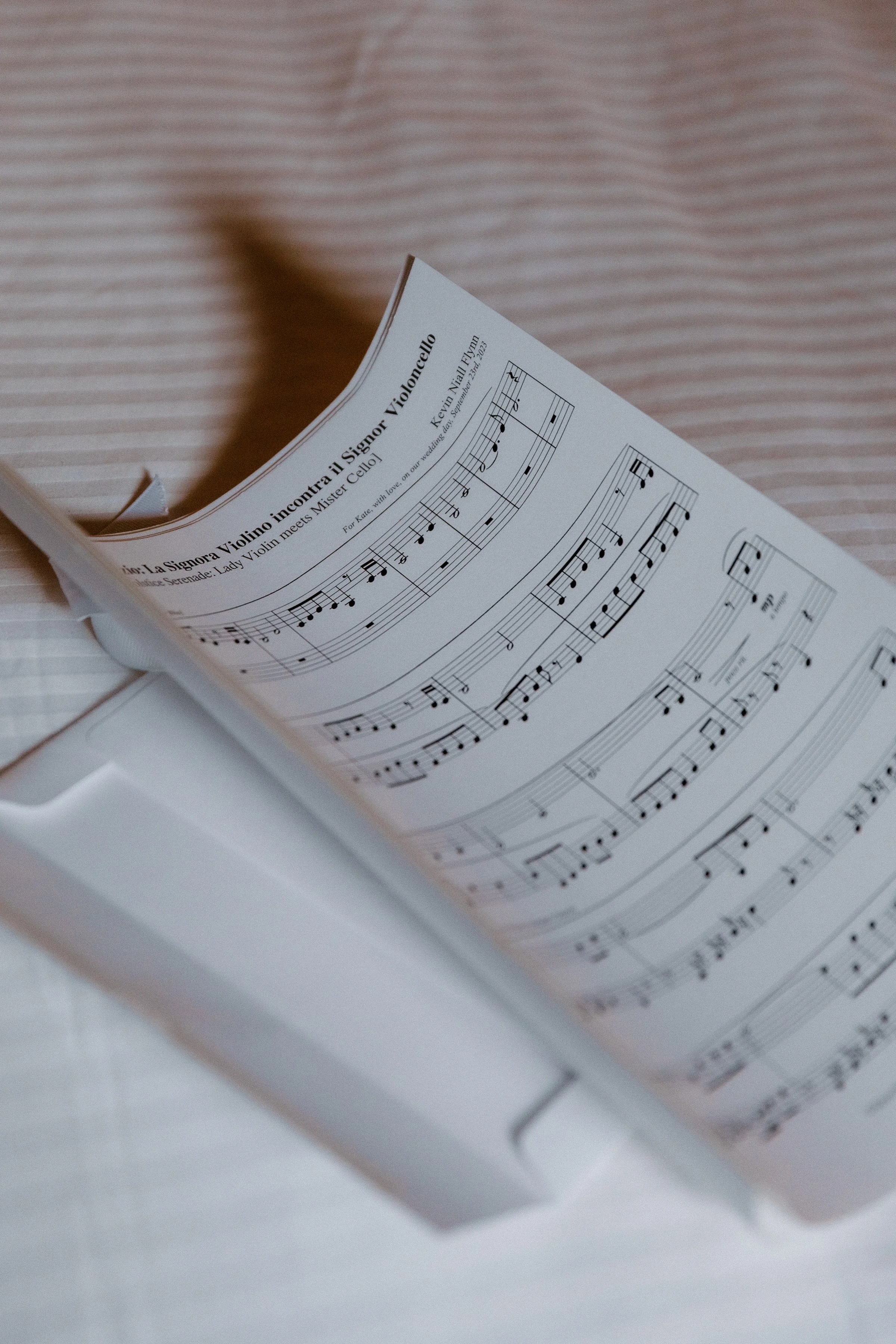 Detail photo of a sentimental sheet music gift exchanged between a couple on their Toronto wedding day
