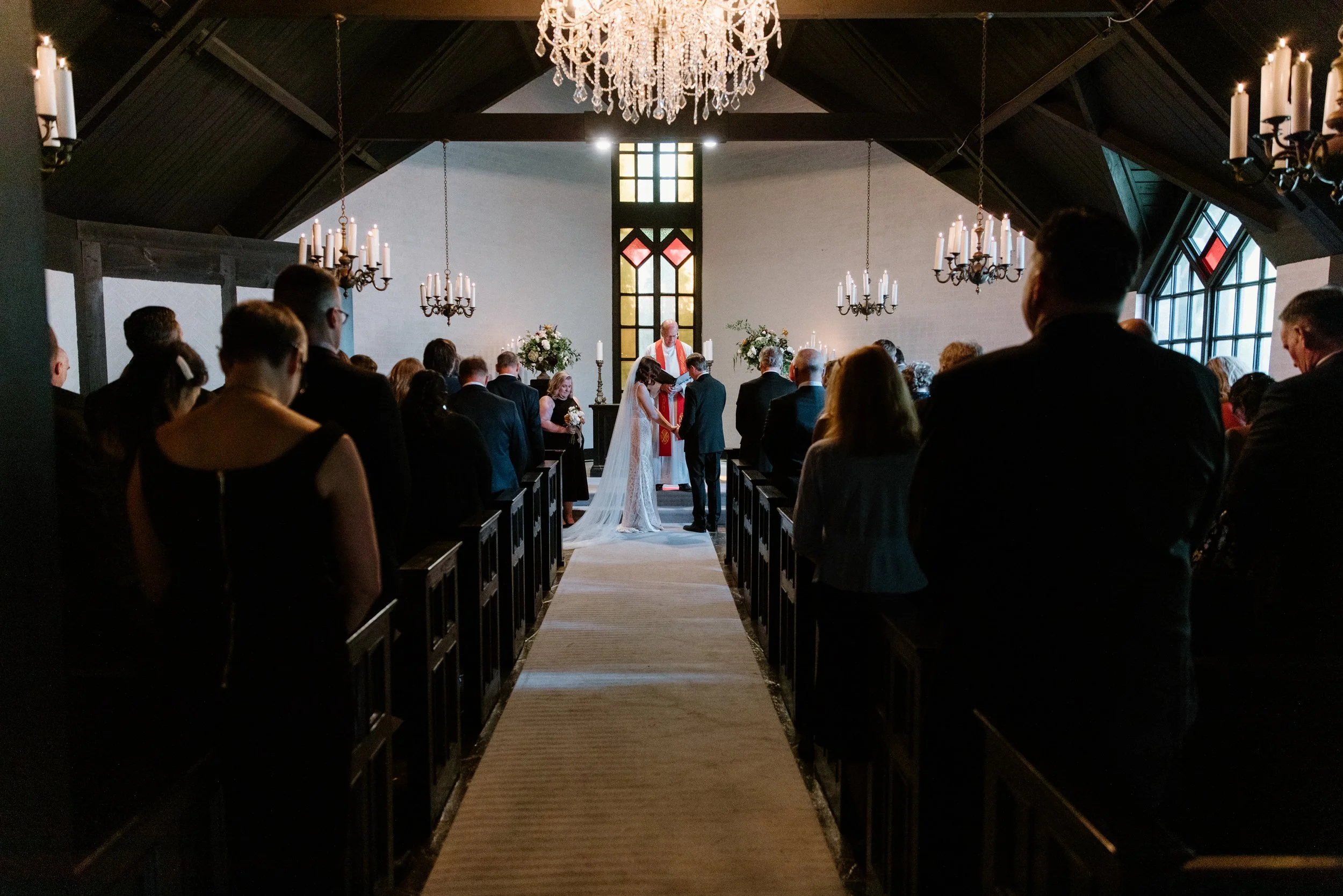 Wide room photo of a wedding ceremony in Toronto with all guests standing