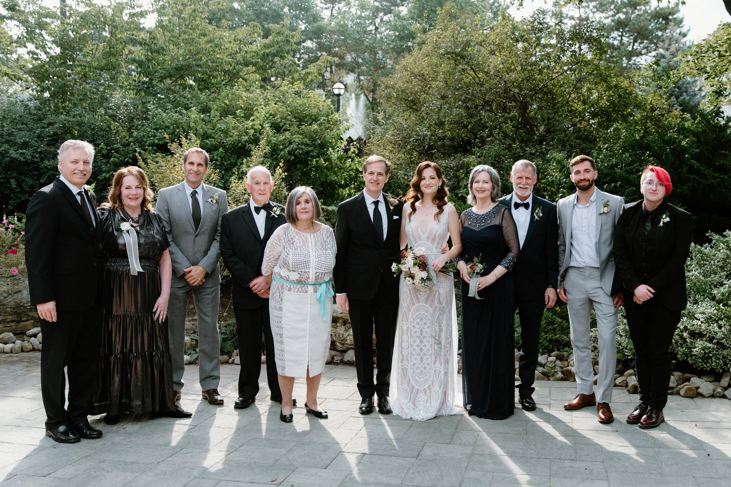 Formal family portrait in a garden at a Toronto wedding