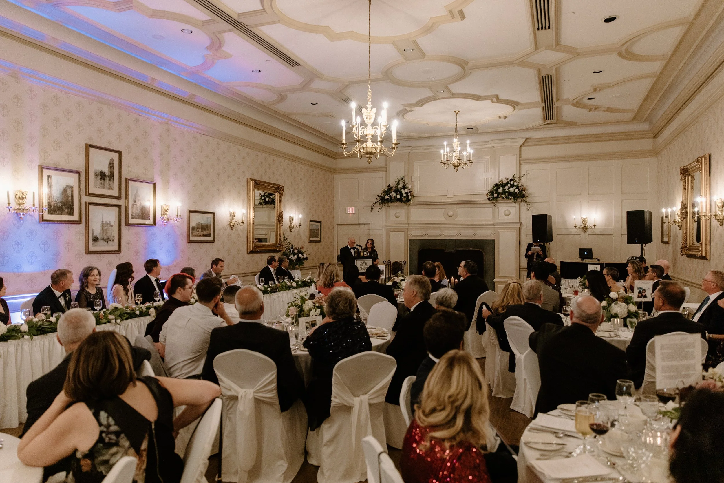 Wide room photo of a guest making a speech during a Toronto wedding reception