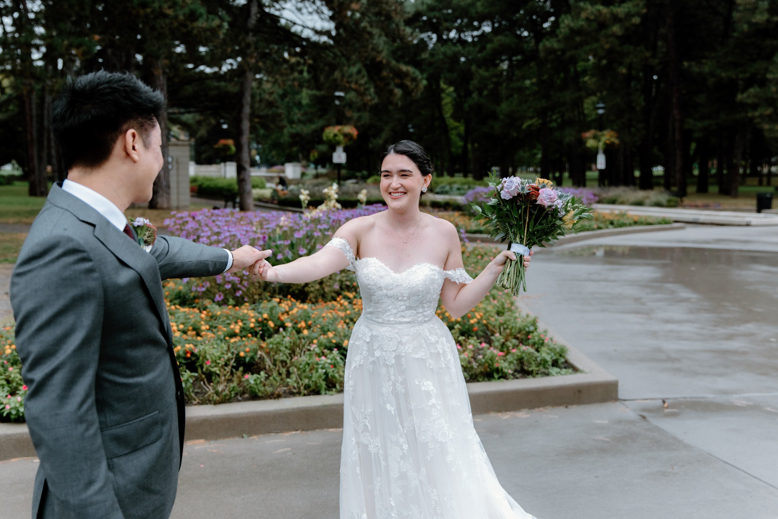 Emotional first look between bride and groom at Gage Park during their Hamilton wedding day