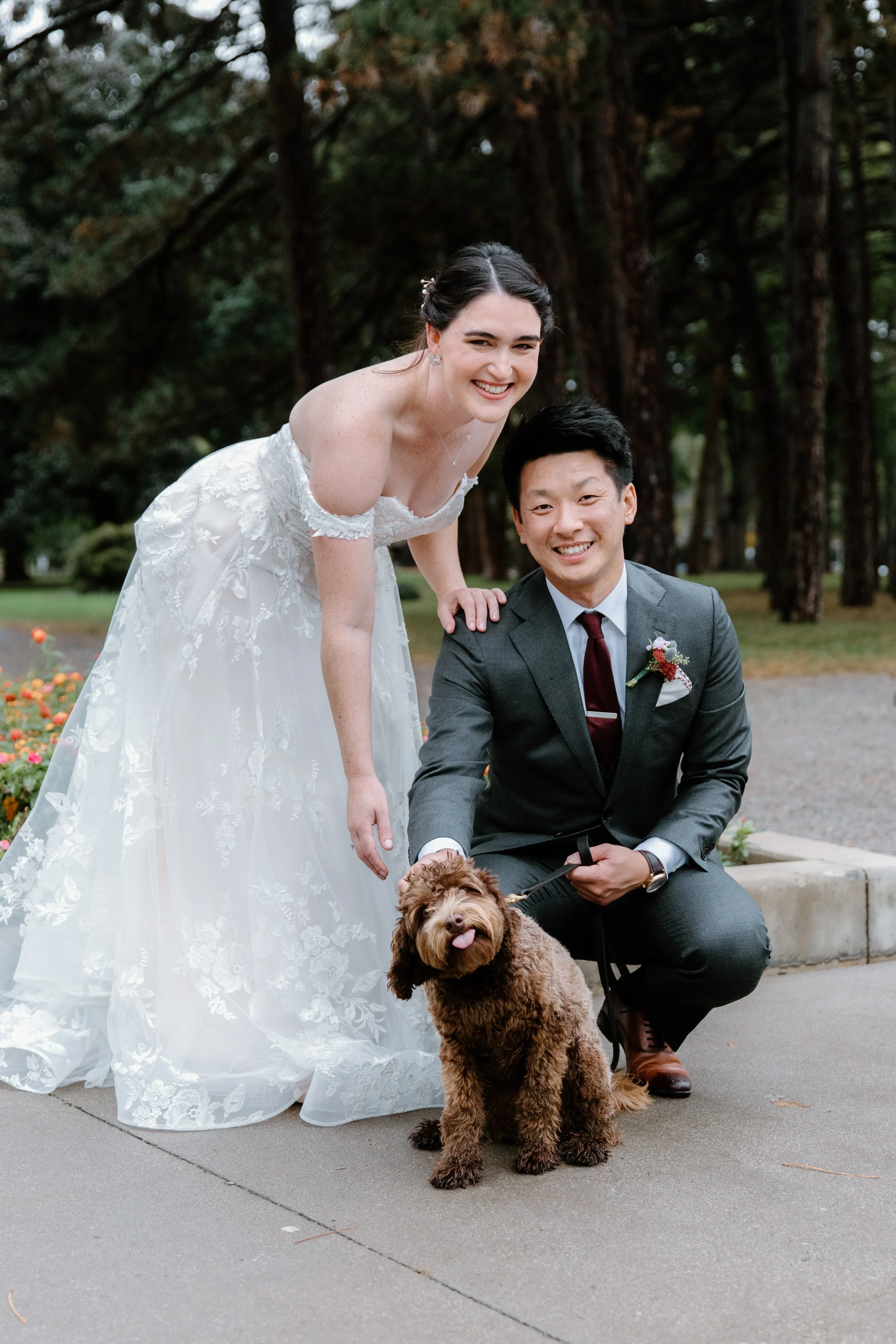 Bride and groom with their dog at Gage Park during their Hamilton wedding day