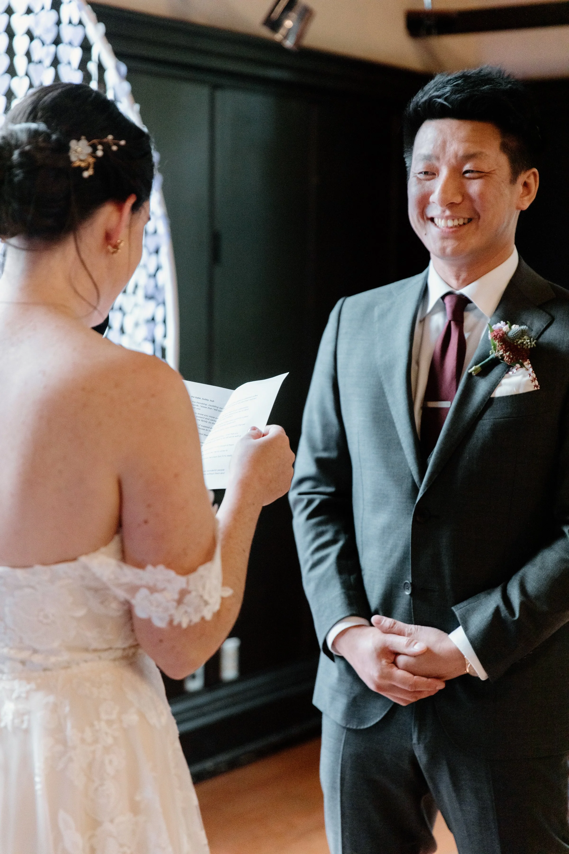 Bride reading her wedding vows during a documentary-style ceremony at McMaster University, Hamilton