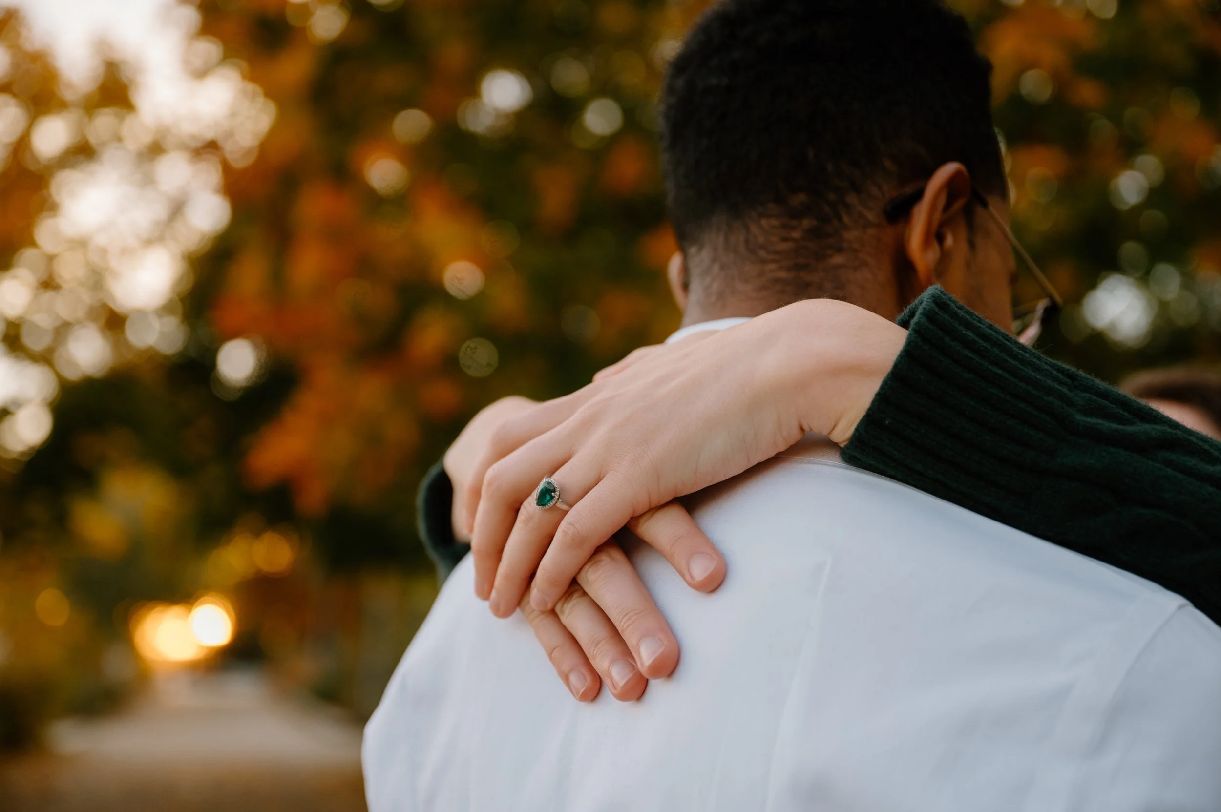 Close up detail photo of an engagement ring during a waterfront engagement session in Toronto