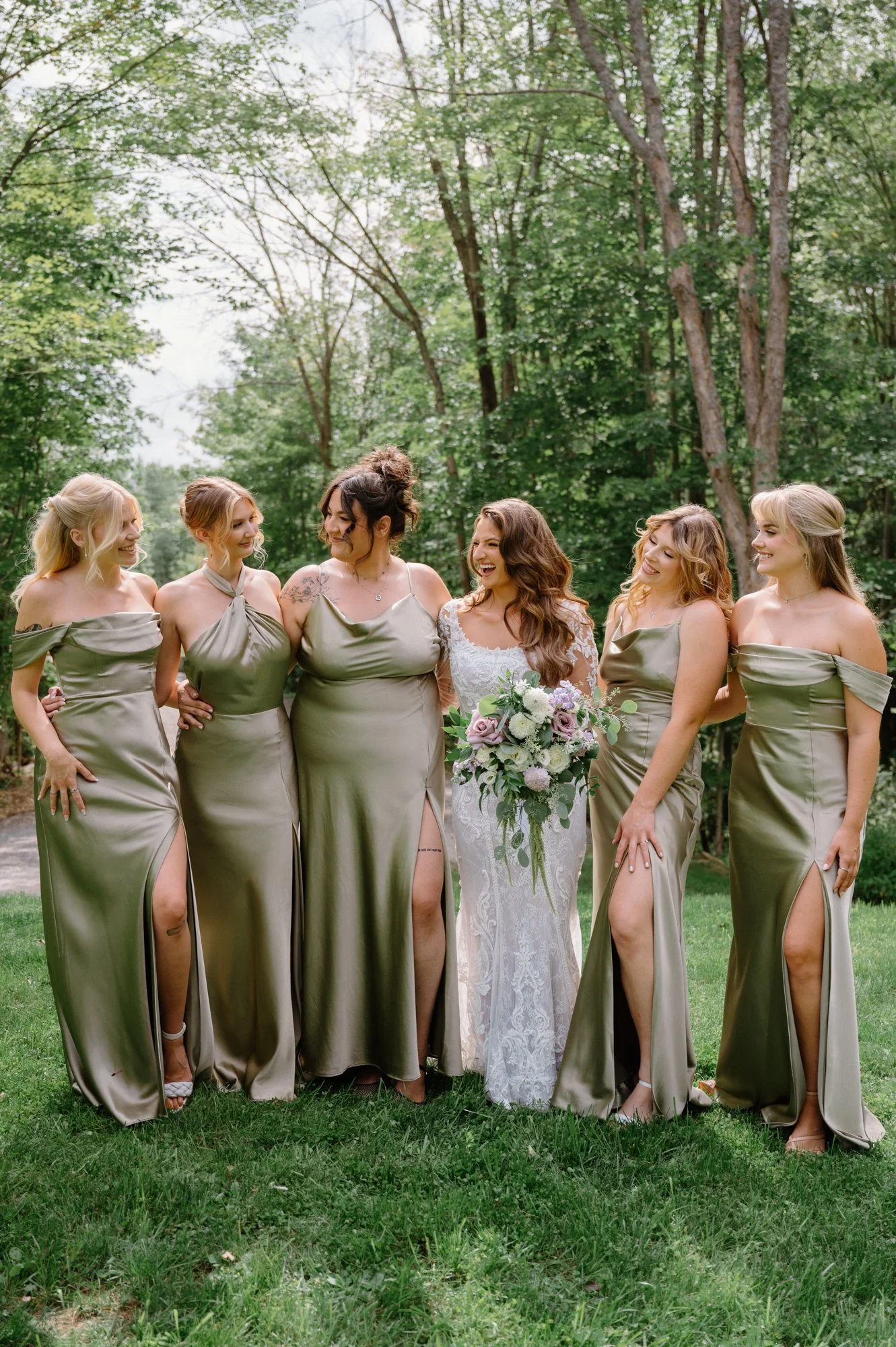 Bride with bridesmaids in green dresses at a wedding