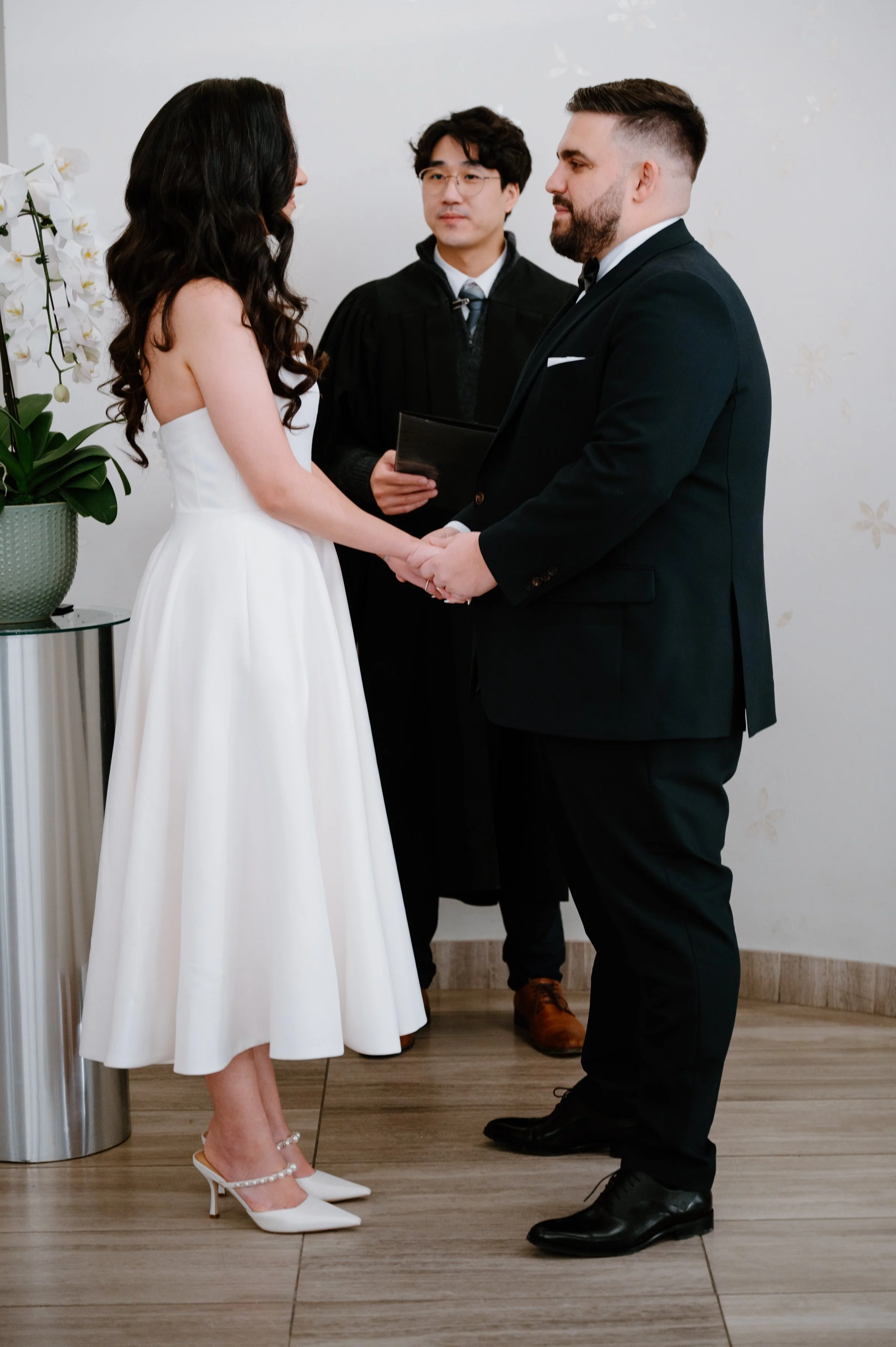 Ceremony moment captured during a modern City Hall elopement in Toronto