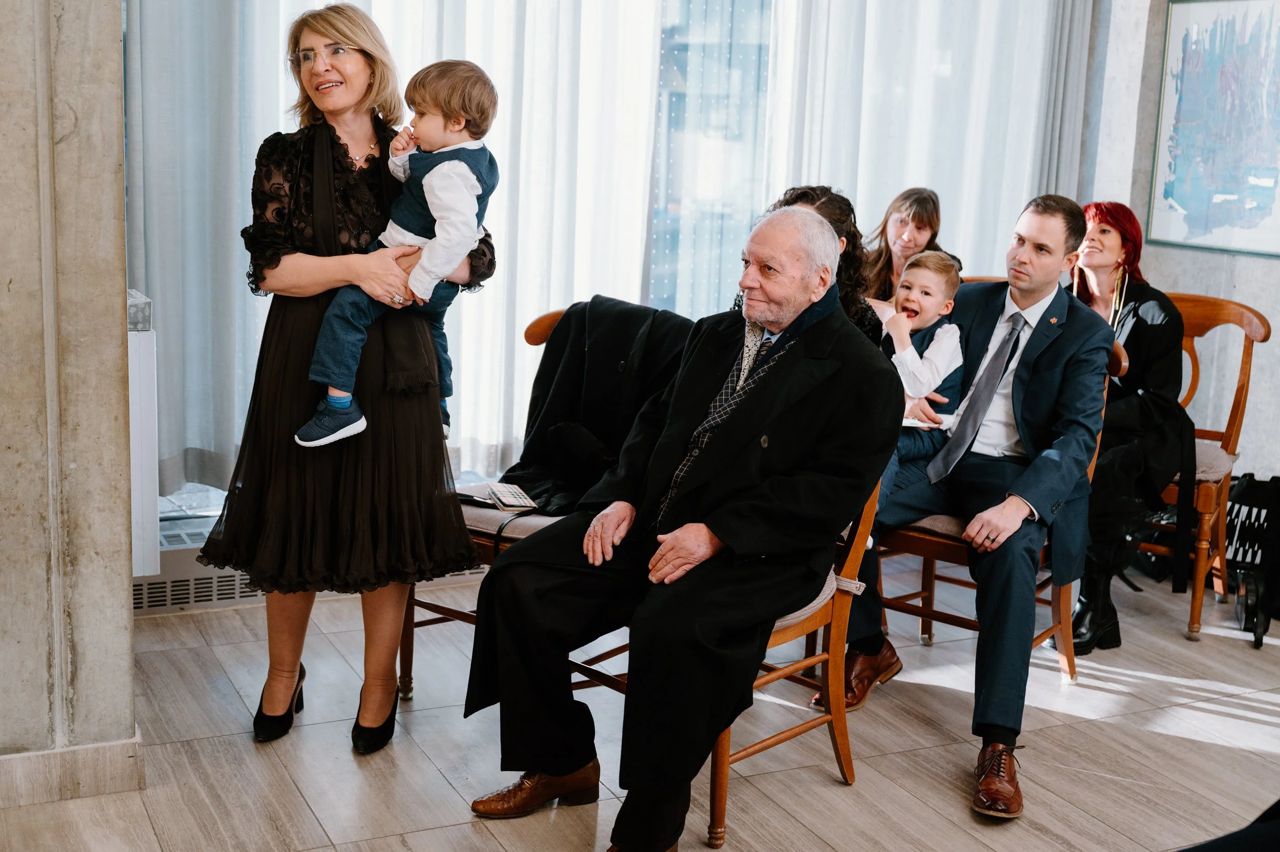 Guests seated during an intimate elopement ceremony inside Toronto City Hall