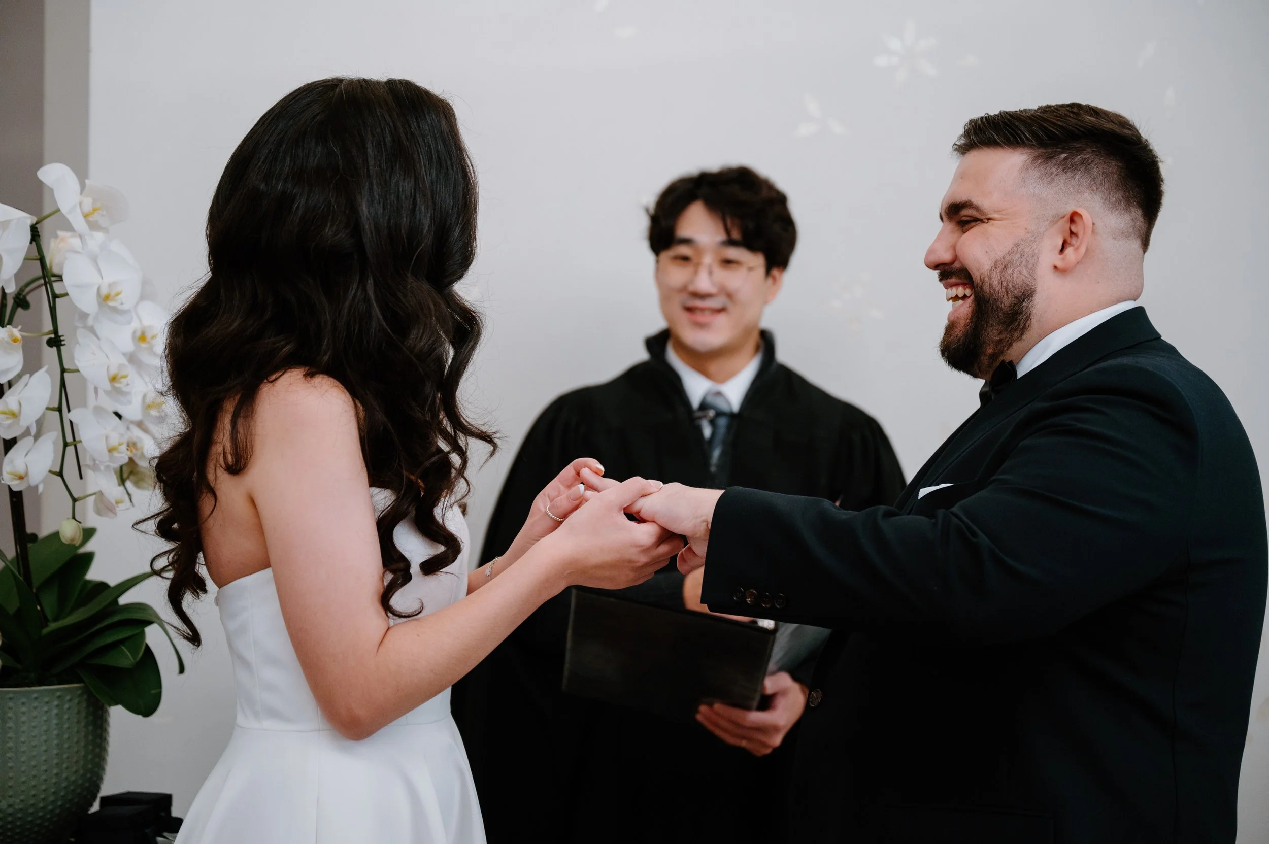 Intimate winter elopement ceremony photographed at Toronto City Hall