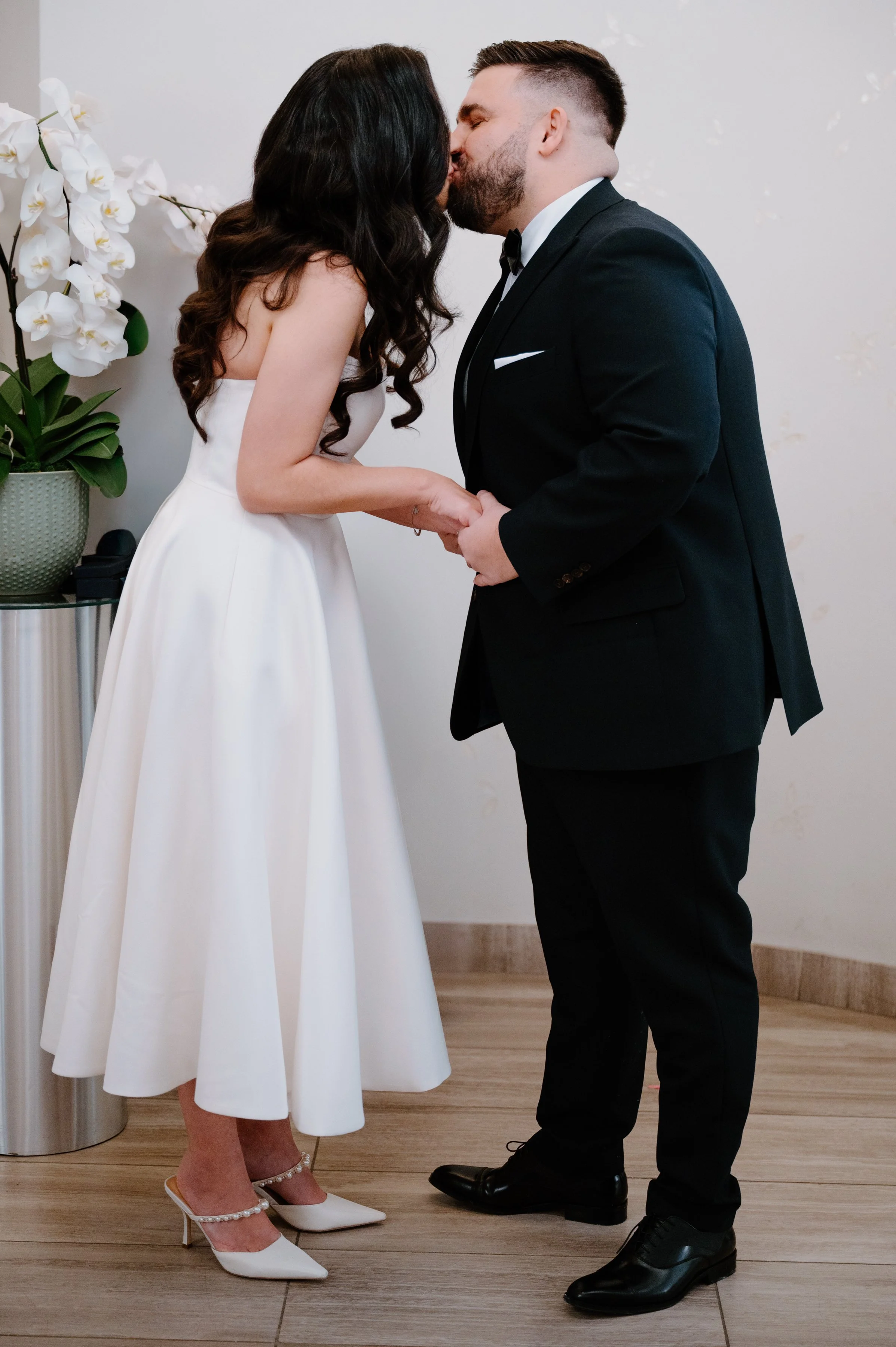 Documentary-style ceremony moment during a City Hall elopement in Toronto