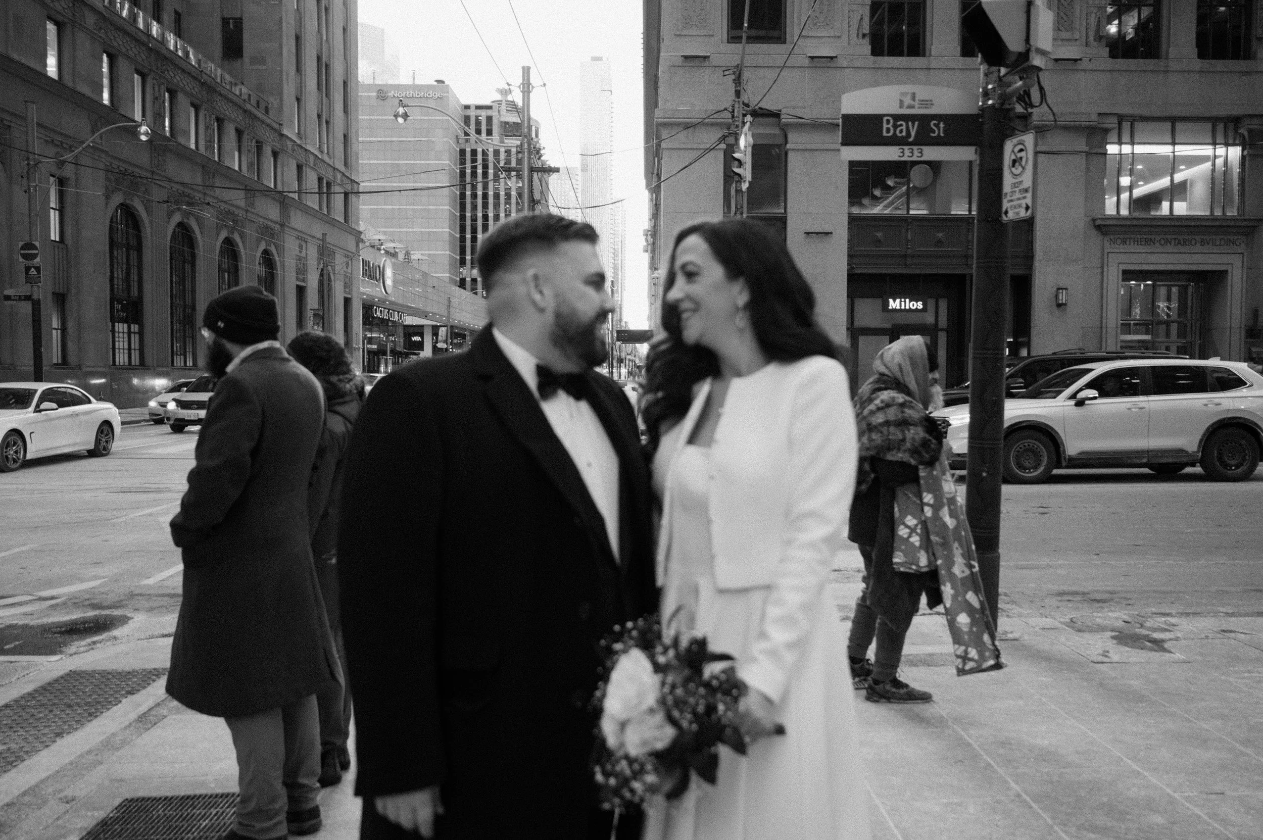 Black and white portrait of an eloping couple outside in downtown Toronto