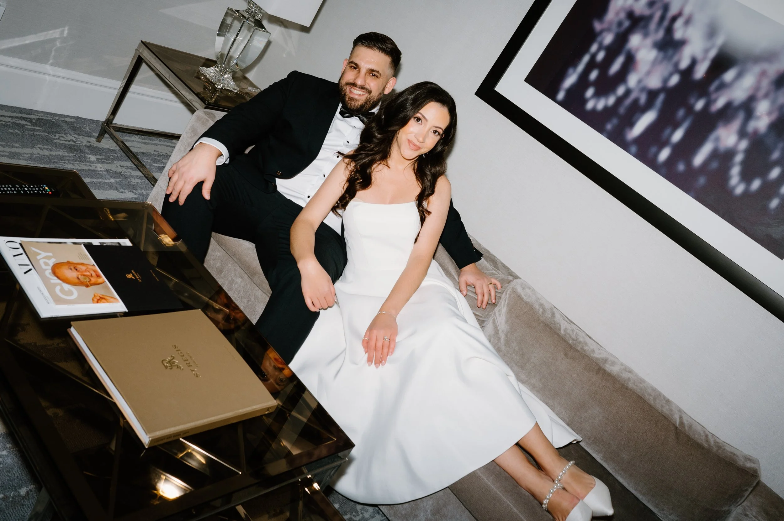 Editorial flash portrait of a couple inside their St. Regis Toronto hotel room