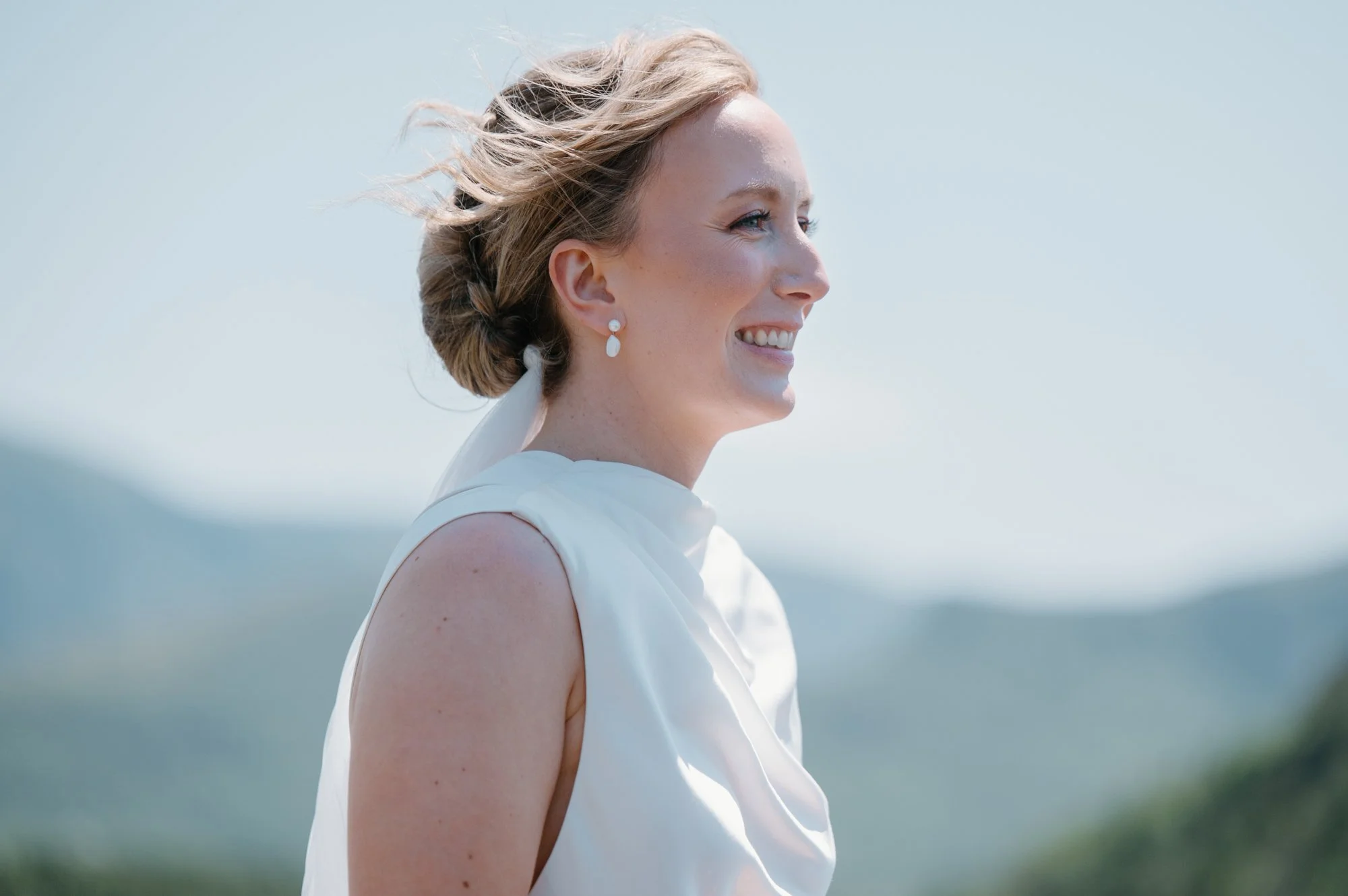 Candid close up portrait of a bride during her outdoor destination wedding ceremony