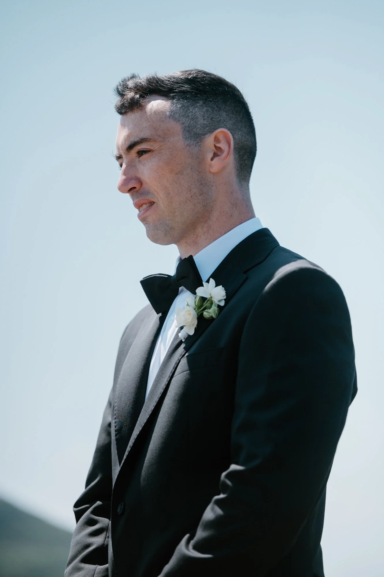Emotional close up portrait of a groom during his destination wedding ceremony