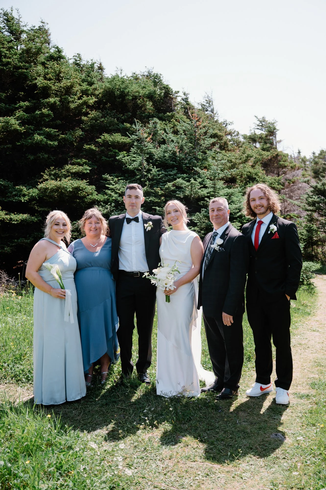 Chic family group portrait taken at a destination wedding