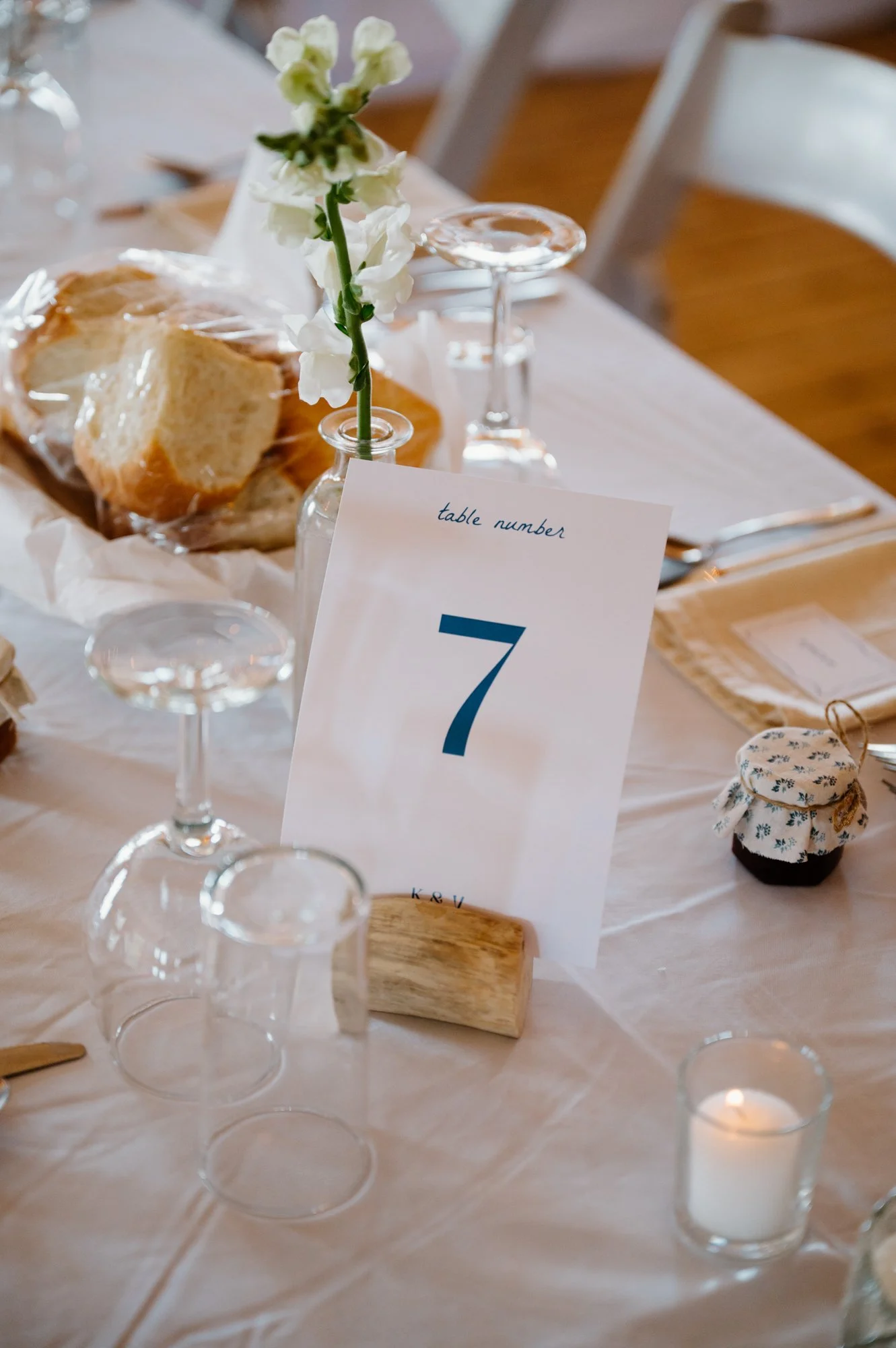 Detail photo of custom wedding stationery on a styled table setting at a destination wedding reception