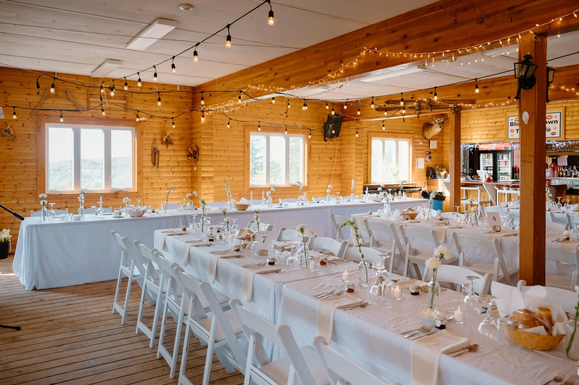 Wide room photo of the reception decor and styling at the Blow Me Down XC Ski Lodge in Newfoundland, no guests present