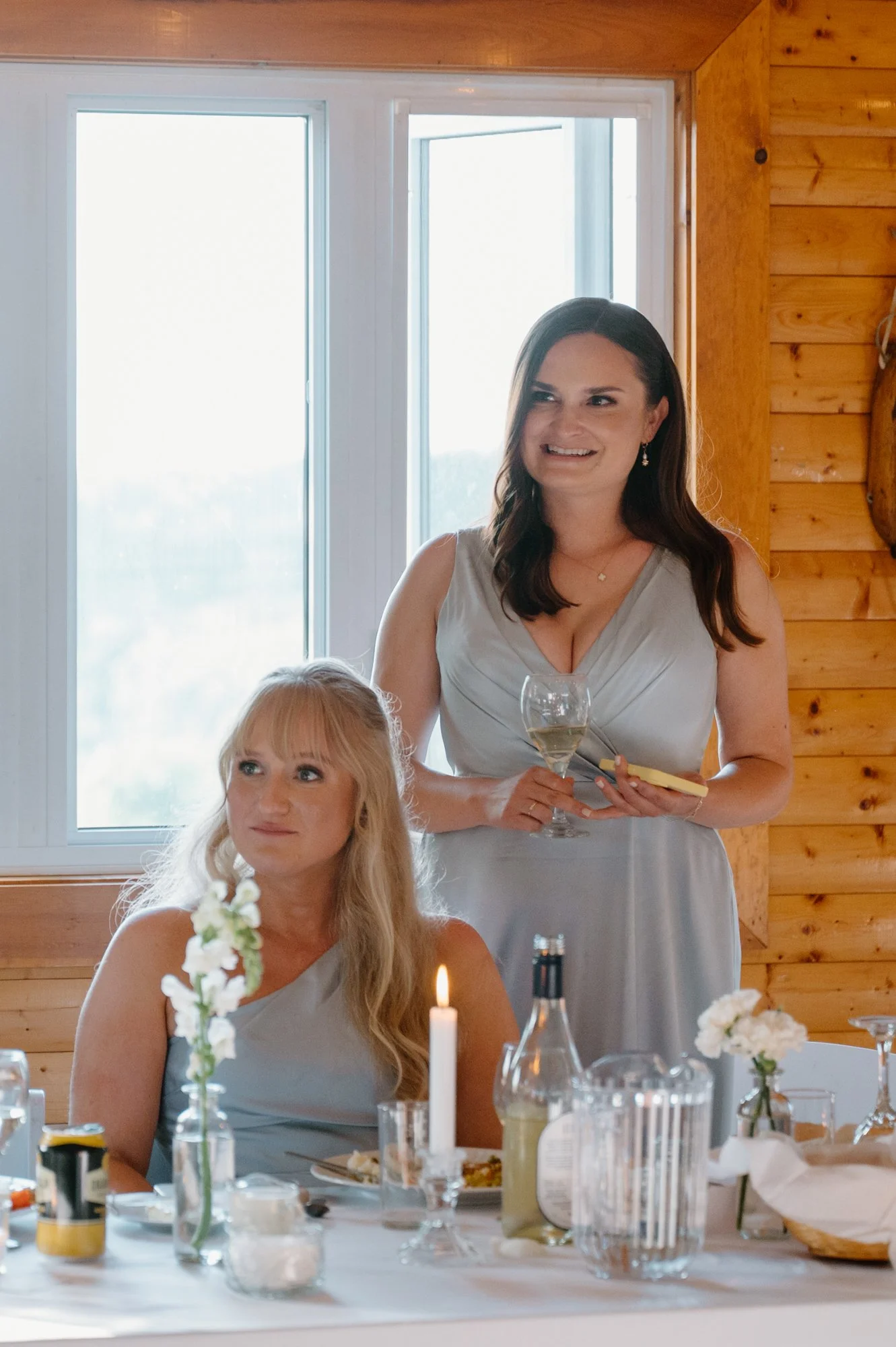 Candid photo of bridesmaids laughing and celebrating during a chic destination wedding reception