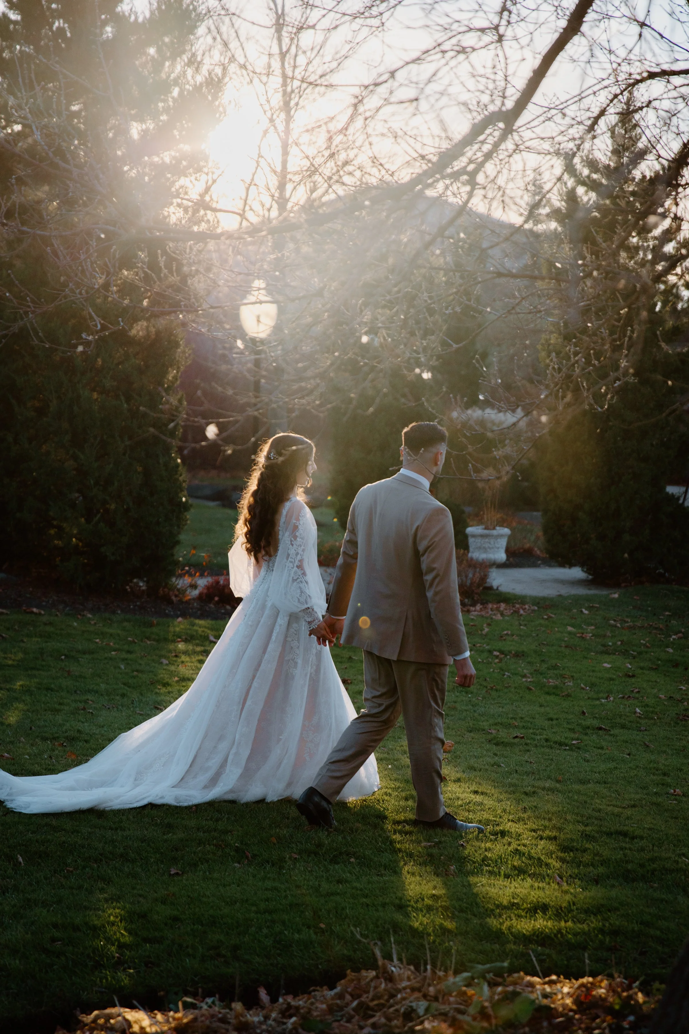 Bride and groom walking together at golden hour at the Royal Ambassador in Caledon, Ontario