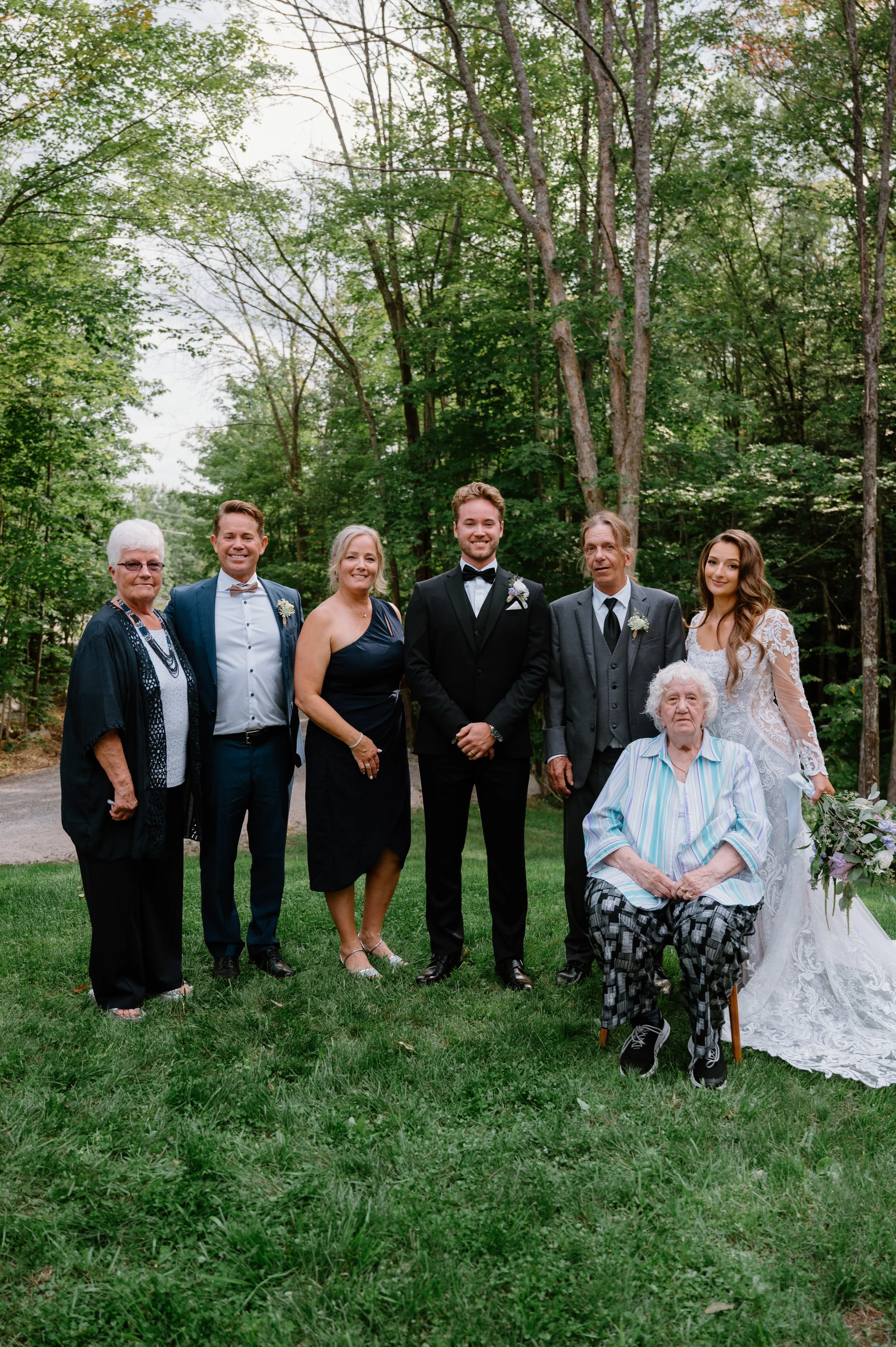 Formal wedding group photo with bride and groom