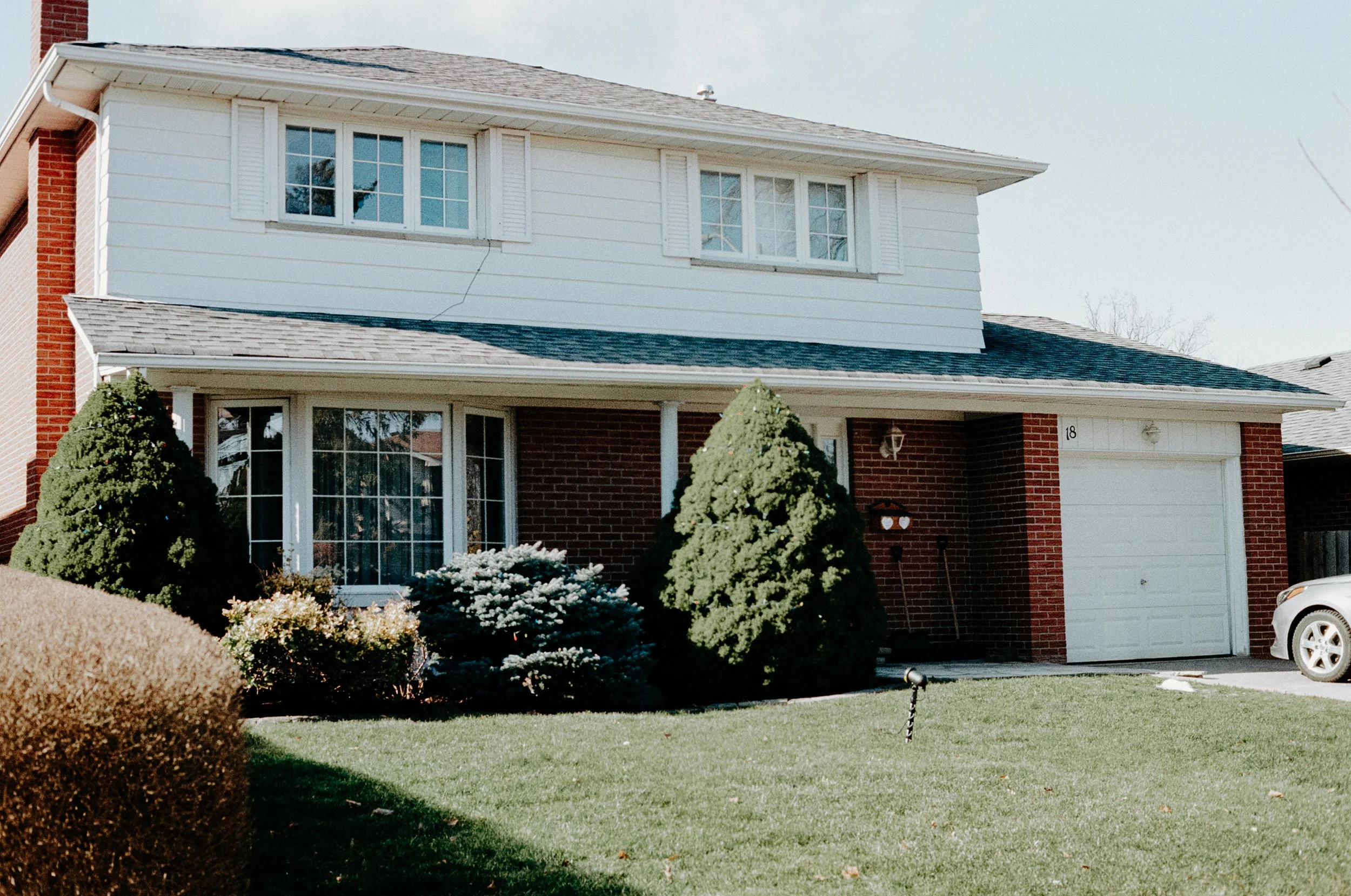 Film photograph of the exterior of the bride's home before an intimate at-home civil ceremony in Toronto