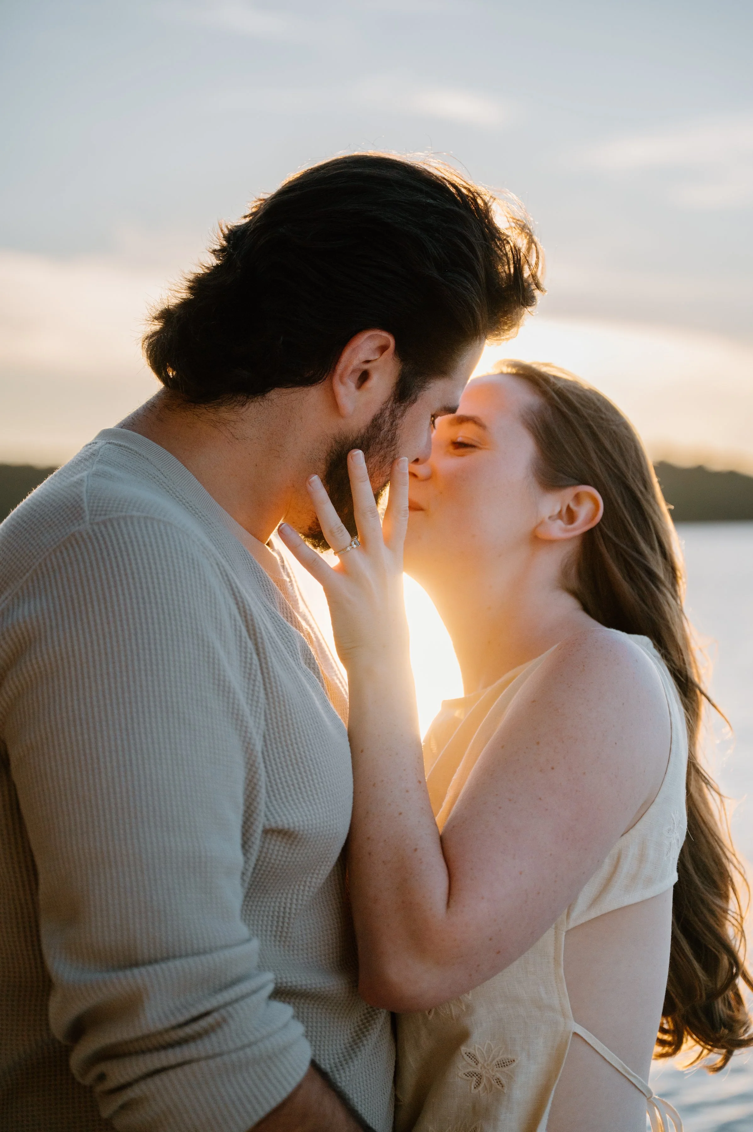 Romantic portrait of a couple at sunset at their cottage in Haliburton