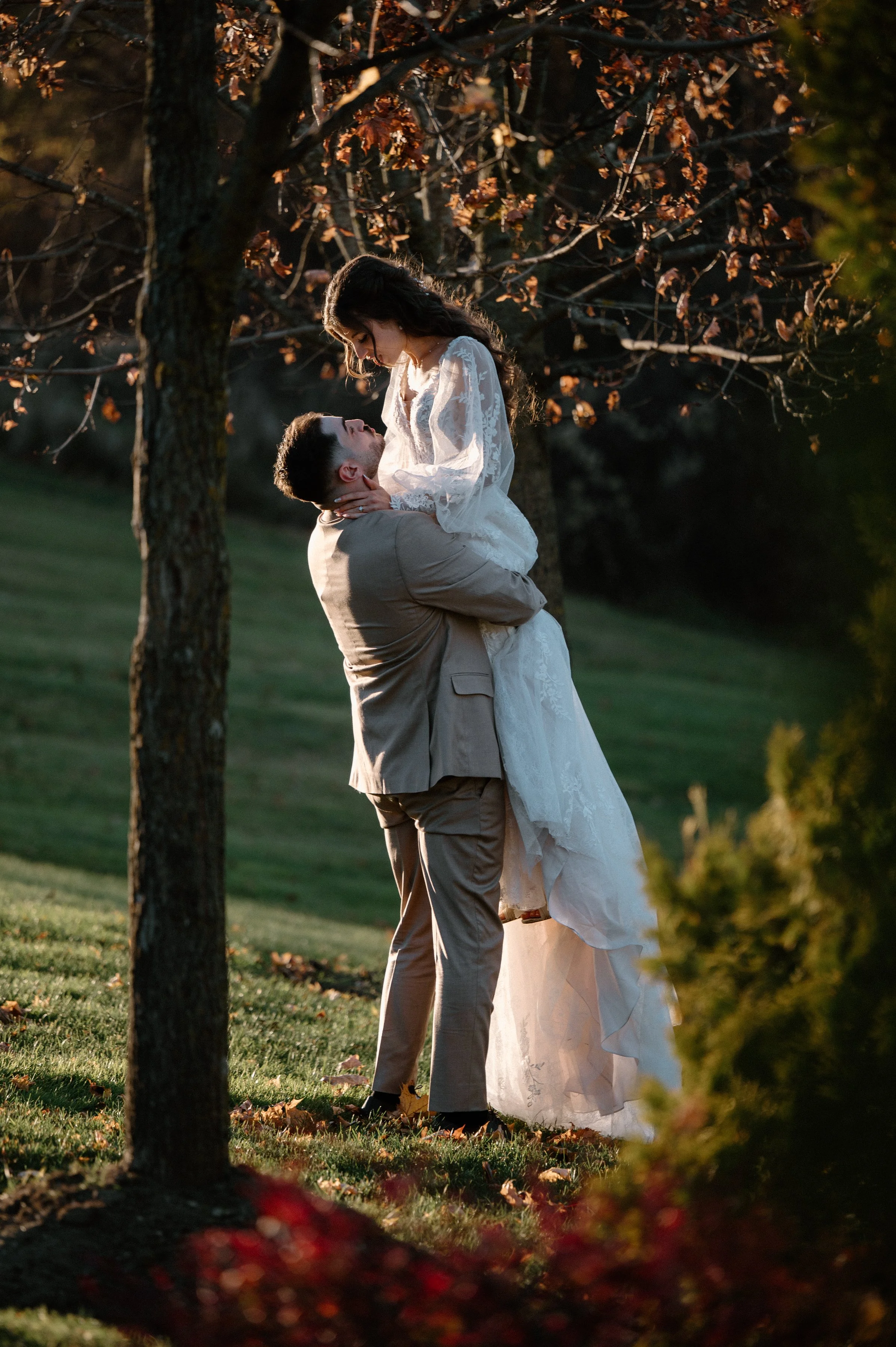 Romantic photo of a groom lifting his bride during golden hour portraits at the Royal Ambassador in Caledon