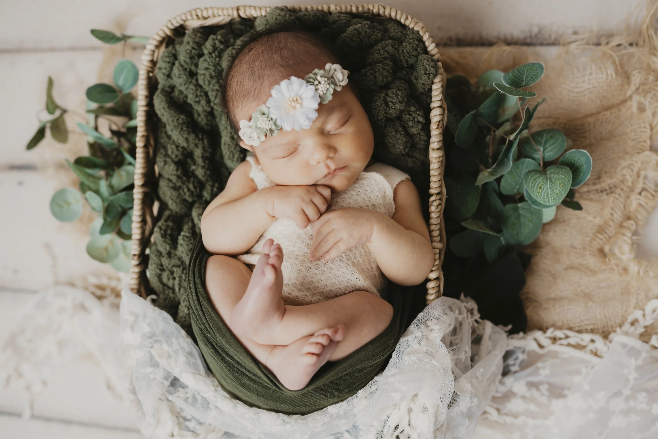 Cleveland Newborn Photographer studio session with baby wrapped in neutral green tones