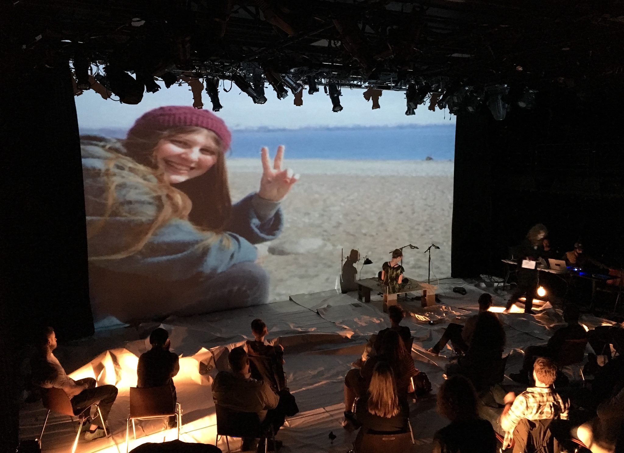  Photographs from June 2017 performance: projected image of Ayse Deniz Karacagil, tortoise stage, paper floor, audience. 