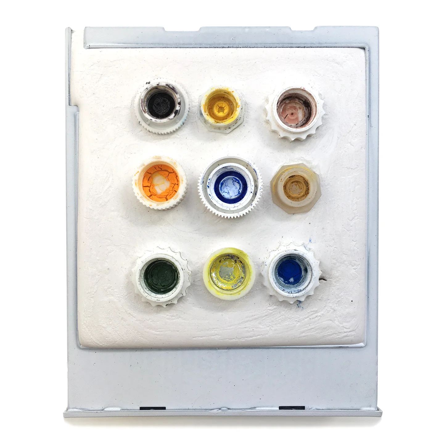 Box 48 - Color Grid, 2006. Polaroid box, Paris plaster, plastic tops, gouache. W3.75" x H4.25" x D0.5".