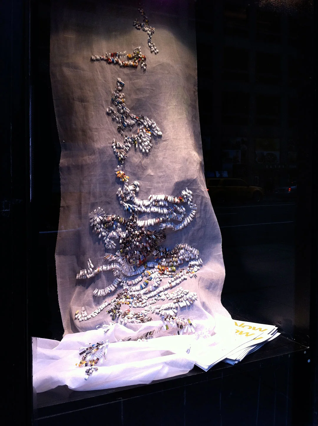 Shredded: Off the Grid, panel 1, installation view at the Manhattan Midown Public Library windows..