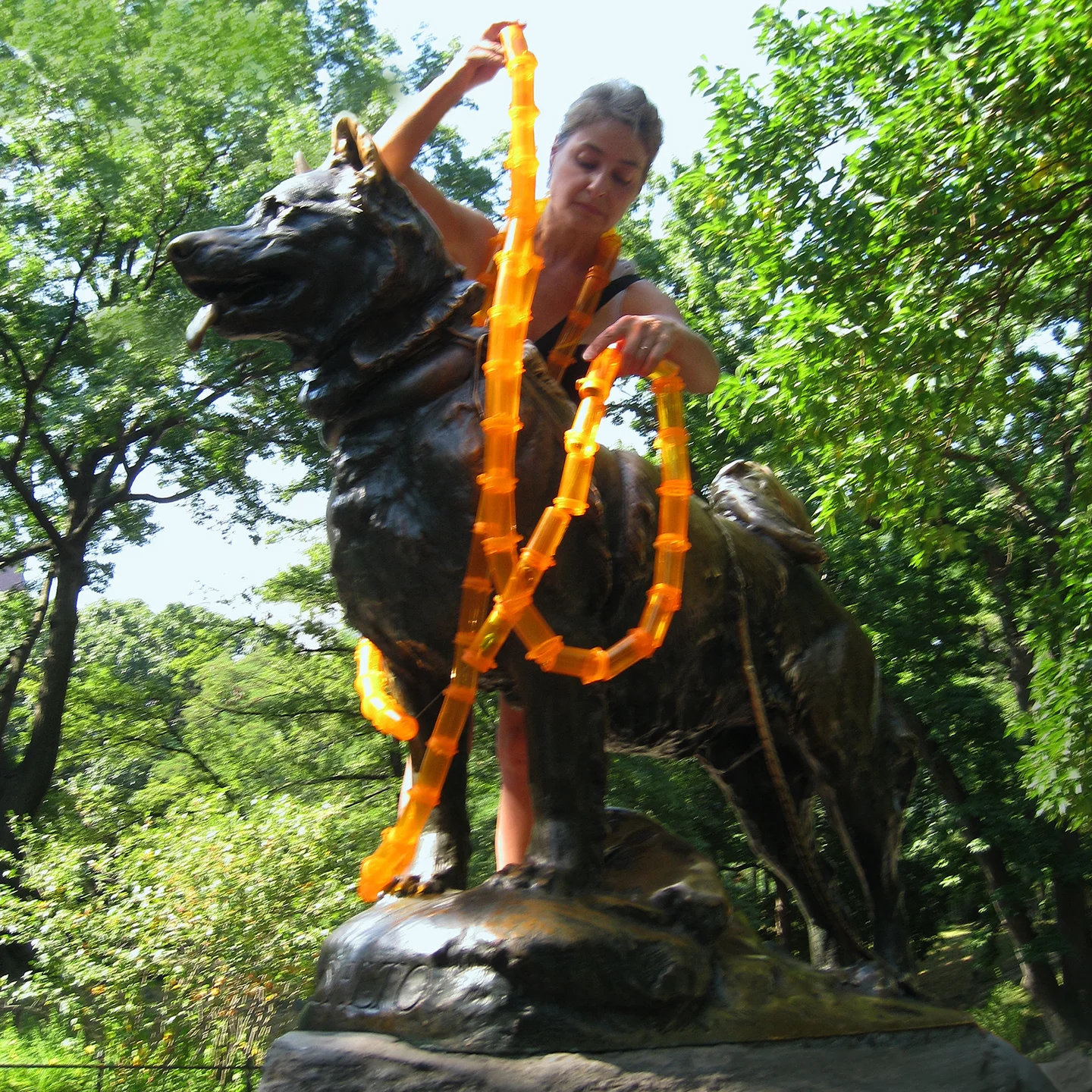 "Eternity incubates a smooth petal, Me As A Goddess 4", 2009. Installation on Balto, in Central Park NYC. Sculptor Frederick G. Richard Roth.