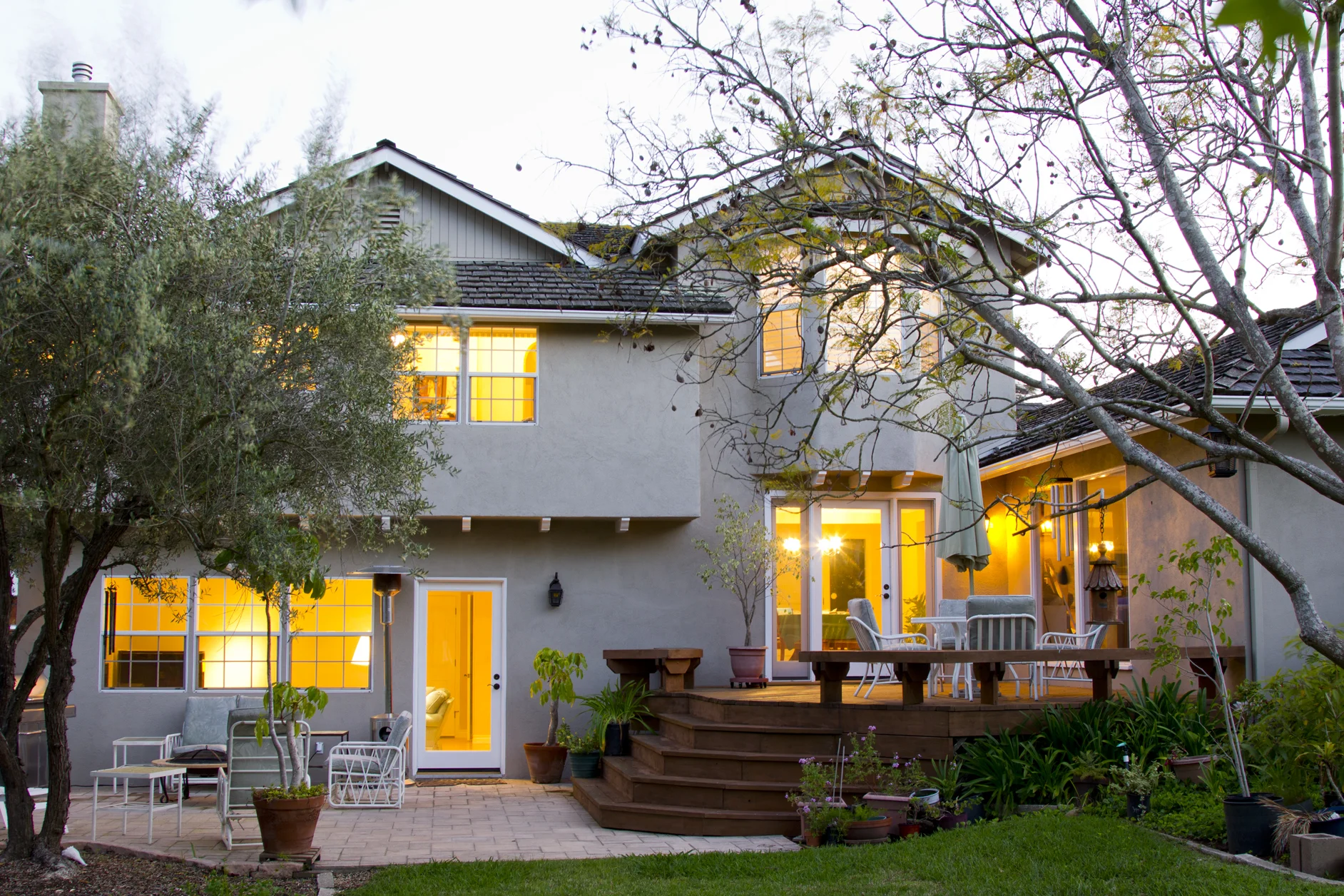 Goleta residence, stucco at dusk with interior lights on