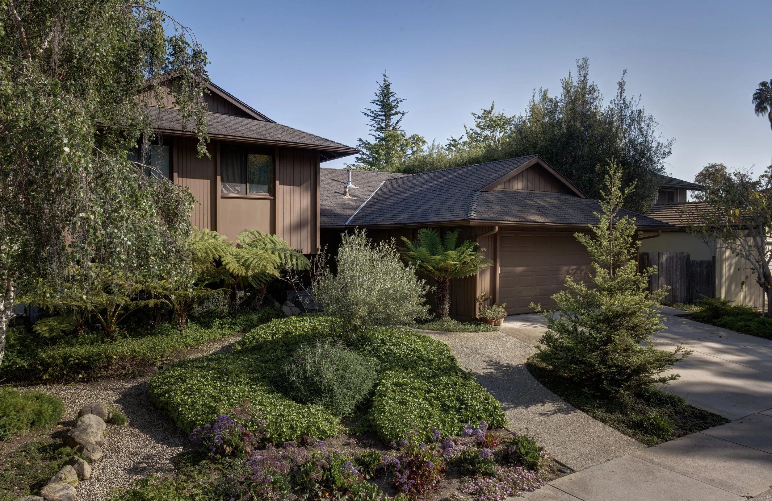 Exterior painting, Goleta residence, earthy brown t-111 paneling