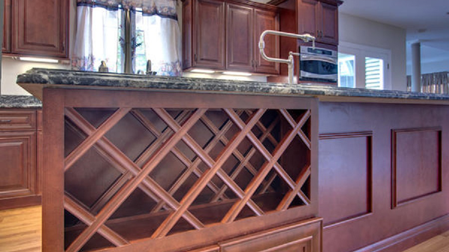 J5_Red_mahogany_stained_maple_wood_cabinets_in_a_refined_traditional_style_wine_rack.jpg