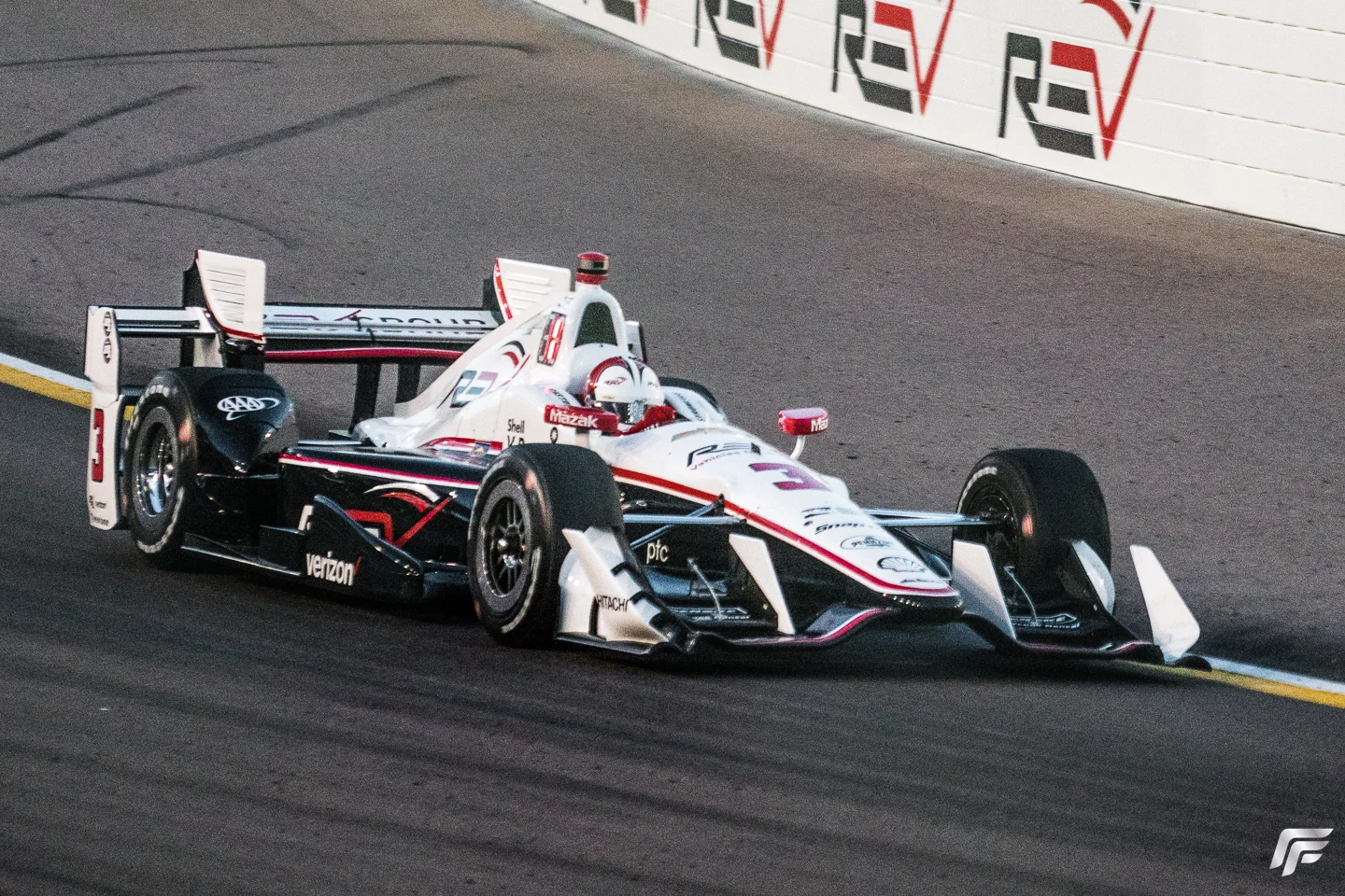 As the sun begins to set over the evening race pole-sitter Helio Castroneves leads the field.