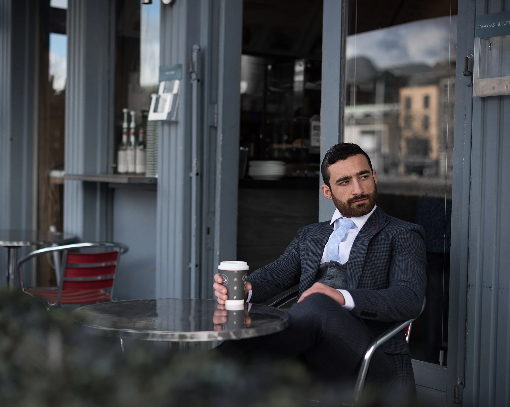 Sohaib-sitting-down-wide-shot WEB.jpg