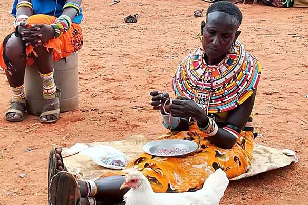 A Samburu woman makes ornaments using beads. Women from nine community conservancies in Samburu Laikipia, Isiolo and Marsabit counties are making necklaces for sale under the sponsorship of Northern Rangelands Trust. PHOTO | FILE | NATION MEDIA GROUP