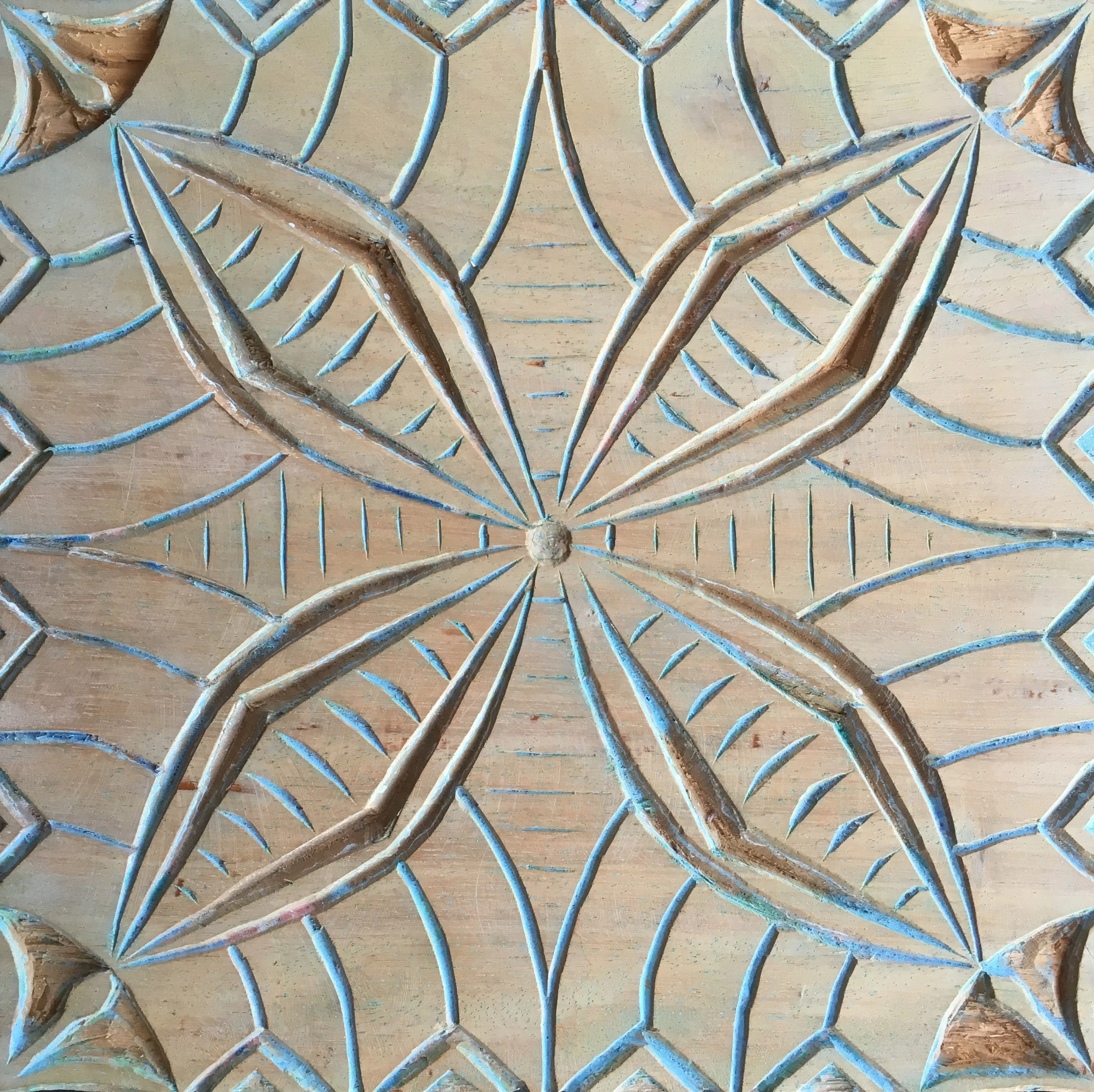 An upeti board that Beth made on the island of Samoa at the Tiapapata Art Centre . Upeti boards are carved and used to print textiles that are then made into a traditional lavalalva or sarong.