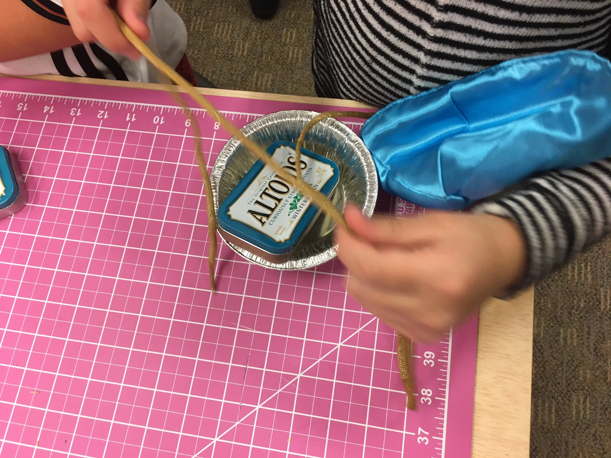 One student questions what to do with their chosen materials.