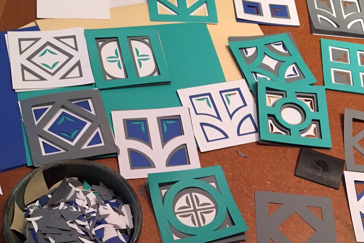 After cutting many squares on my Silhouette, I layered them and moved them around and cut a few more to make the ideal composition.