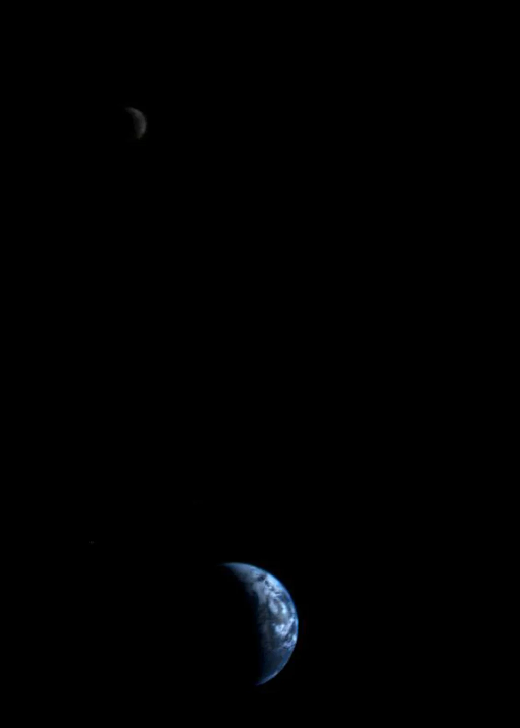 The earth and the moon, captured on September 18, 1977 by NASA Voyager 1 at a distance of 7.25 million miles away from earth. Image via the Jet Propulsion Laboratory at the California Institute of Technology.