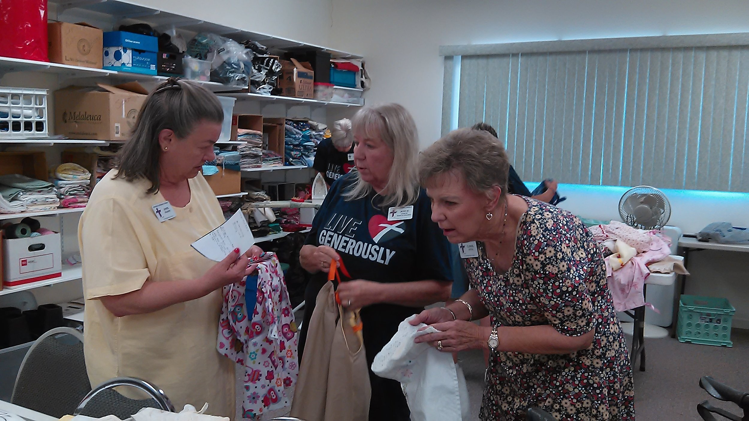 Anne, Joyce, & Carol D picking their dresses.jpg