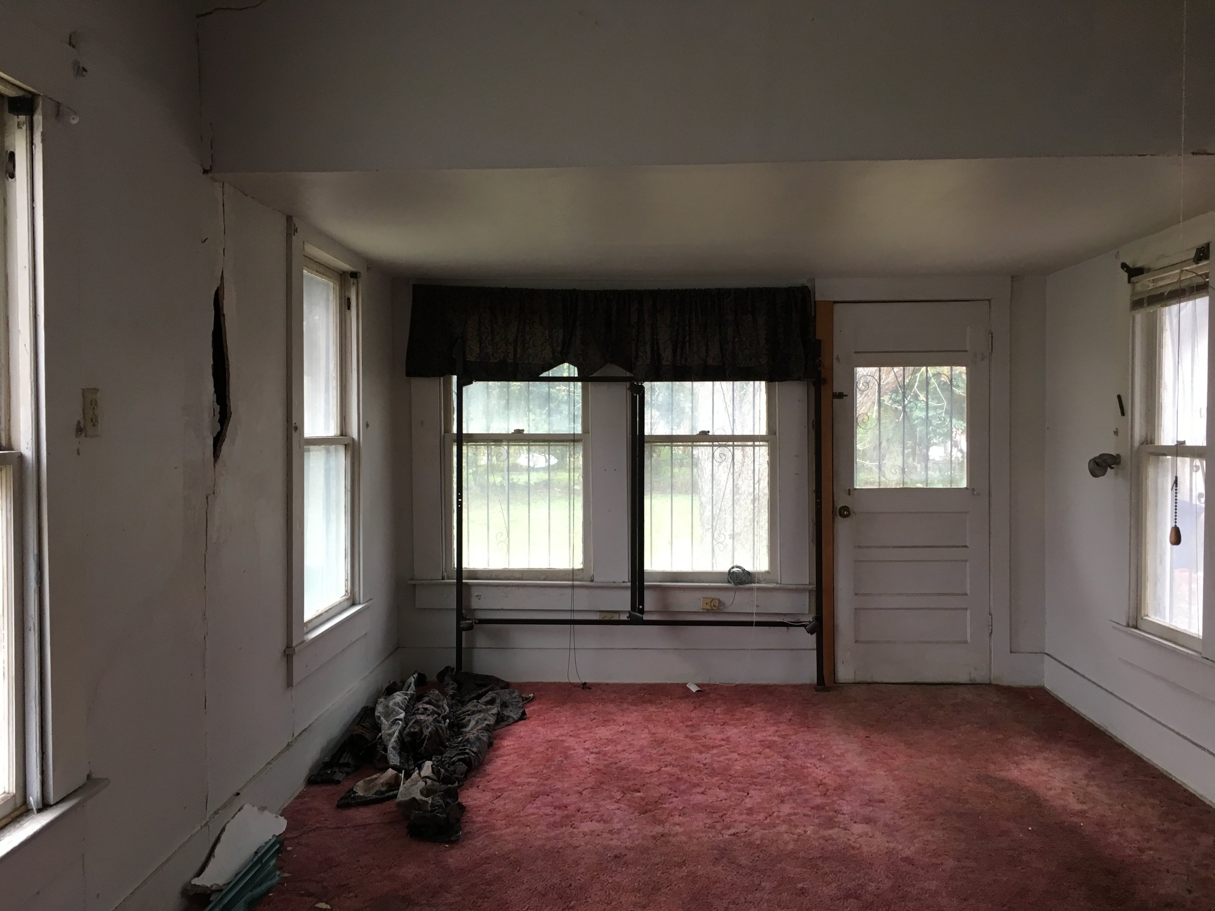  This is the other half of the master bedroom. &nbsp;You are looking at what we think was a converted porch at one time. &nbsp;Obvious reasons behind that would be the lower ceiling height and the exterior door. &nbsp;This are will become the master 