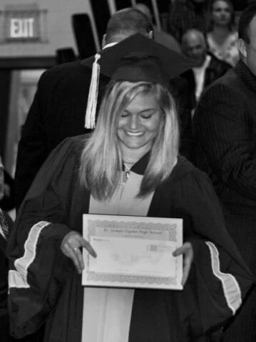 Walking on the stage at graduation to receive the Gary Butler Award.