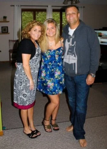 My parents and I on high school graduation day, 2011.