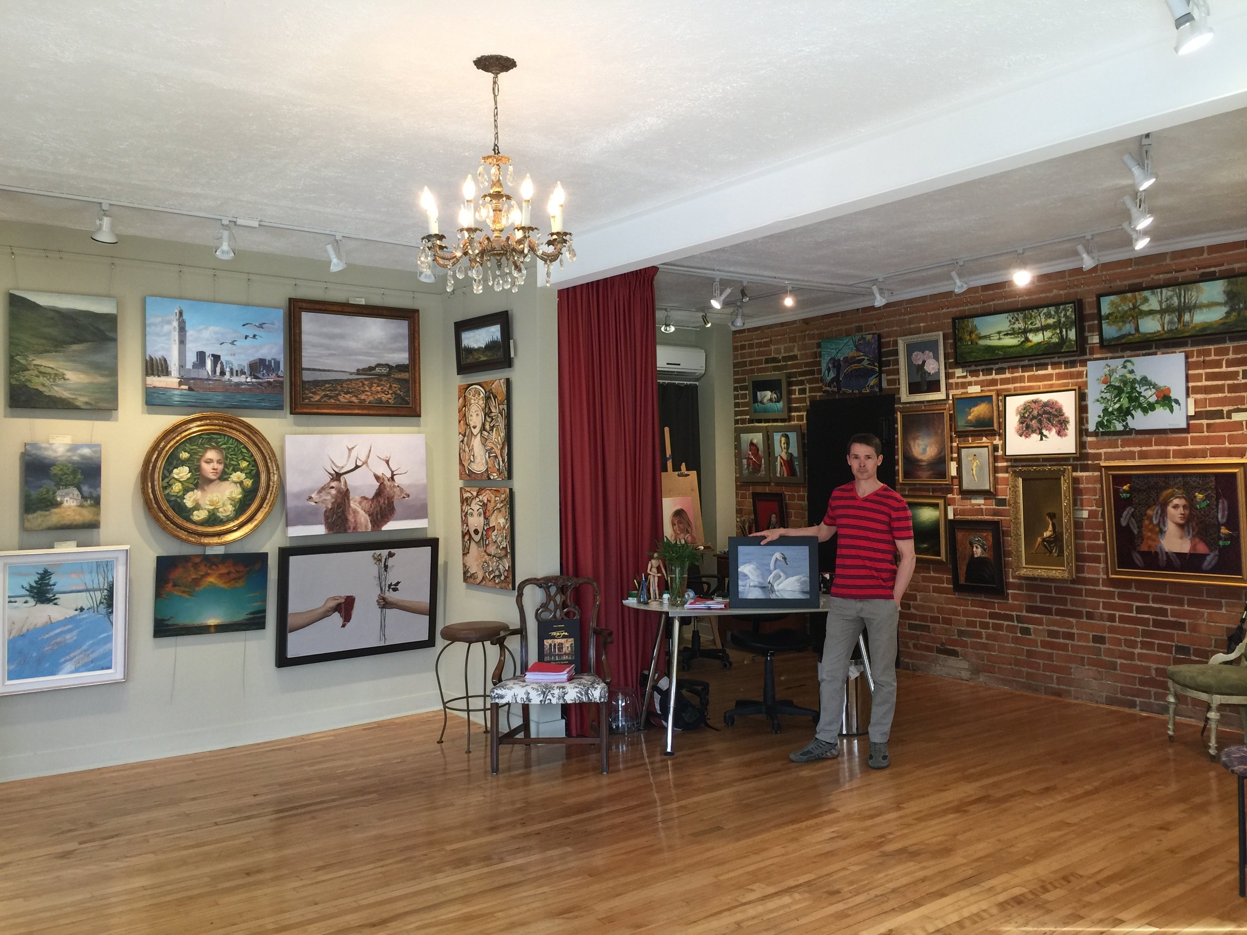Eric Vanasse photographed with his work