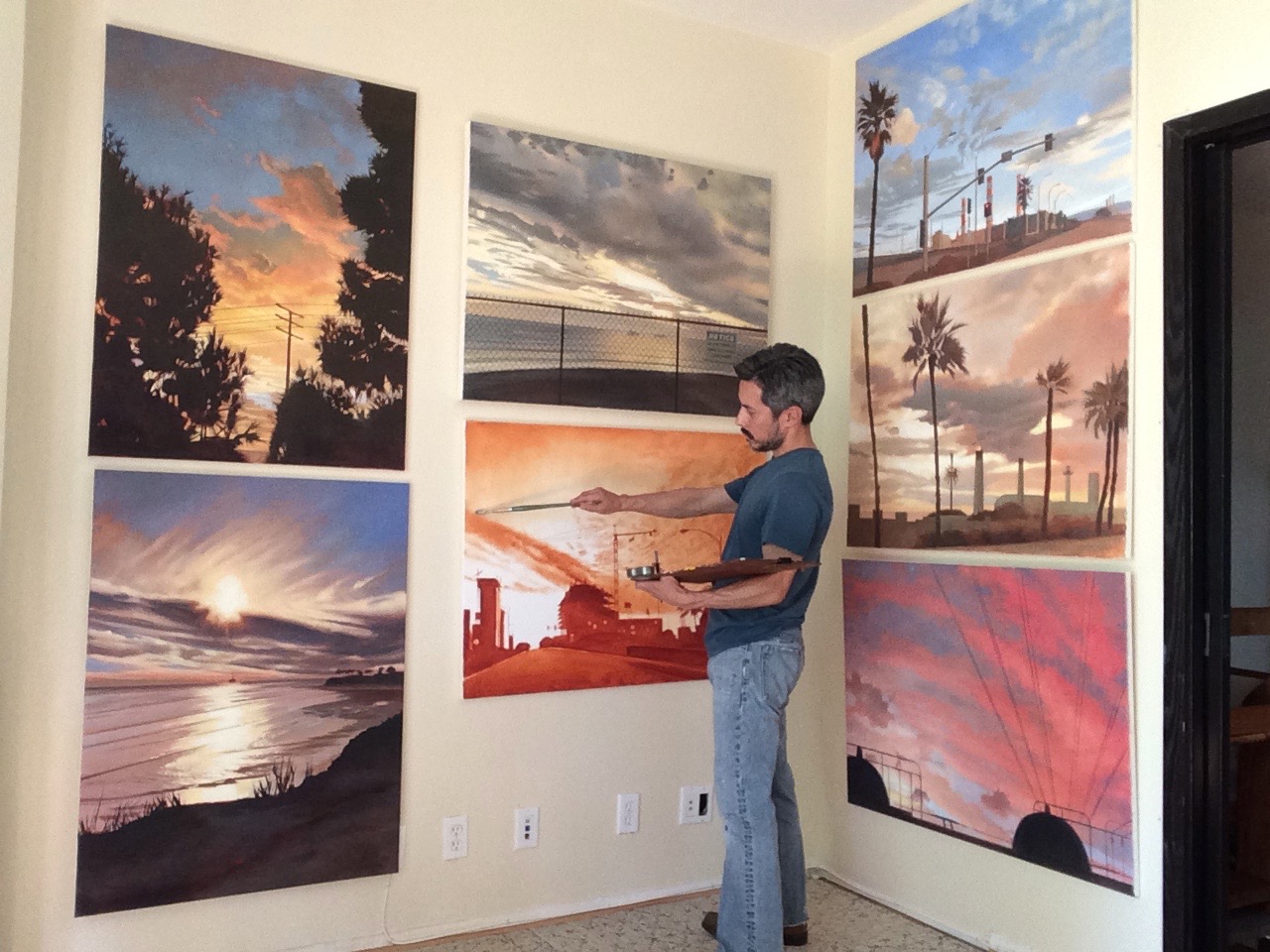 Jesse Aldana photographed with his work