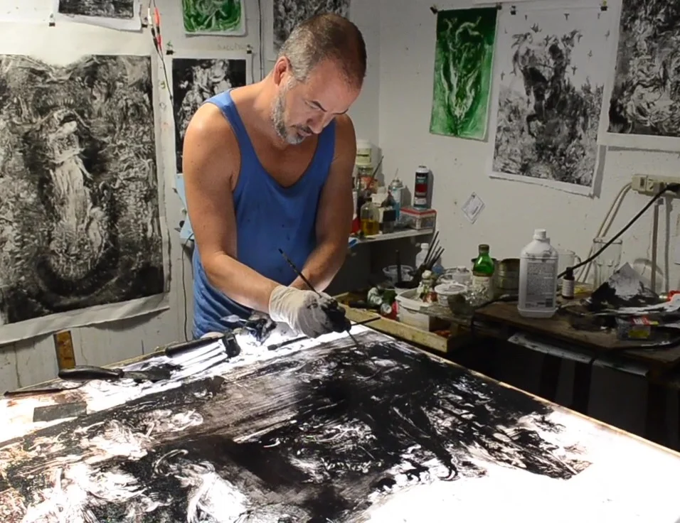 Simon Shawn Andrews working in his studio