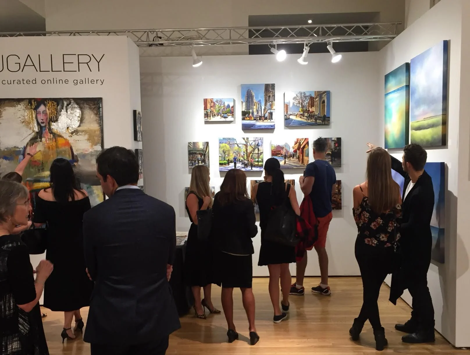 UGallery's featured booth at the entrance of the fair on opening night. 