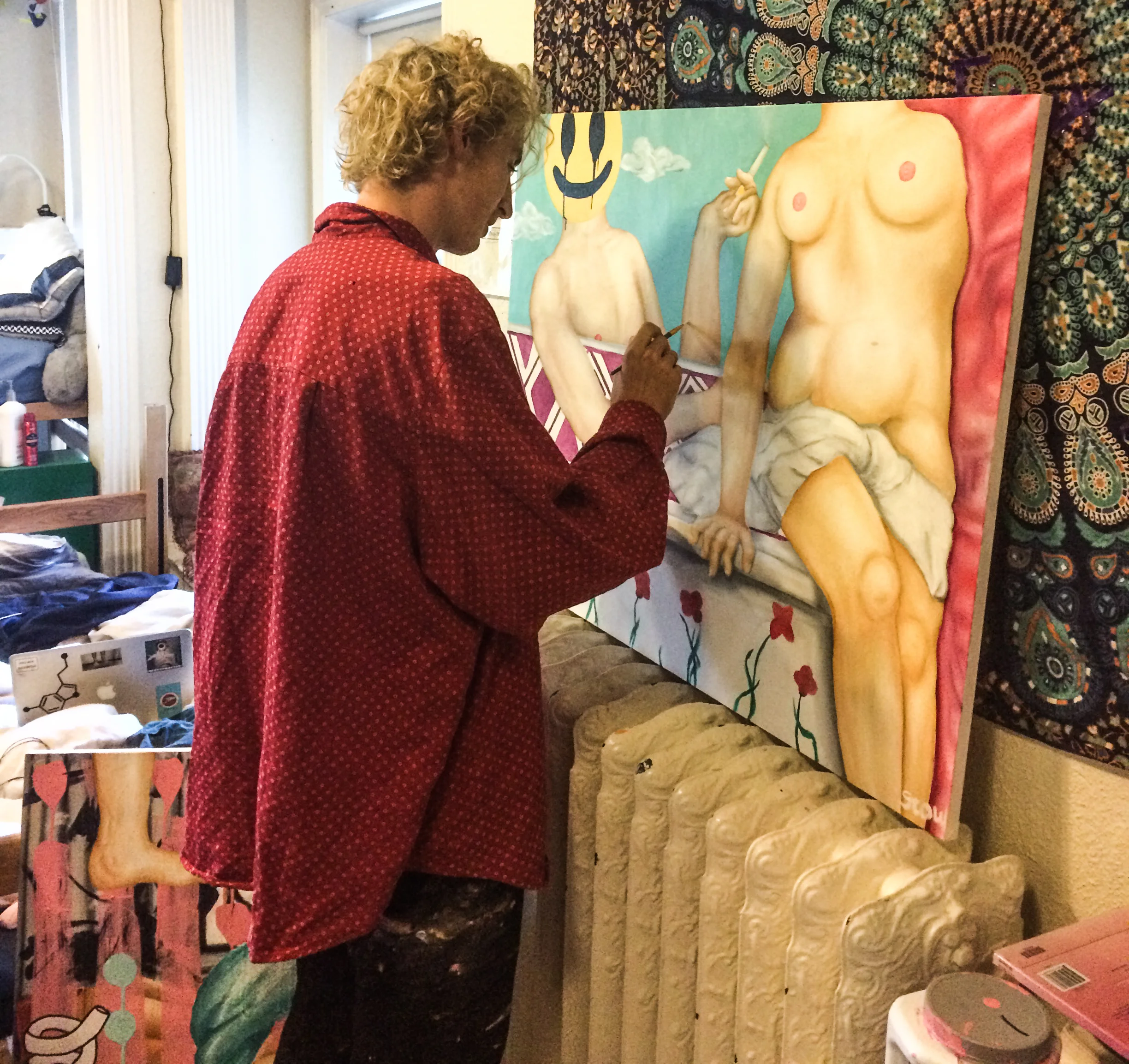 UGallery newcomer Stow Miller working in his dorm room-turned-art studio